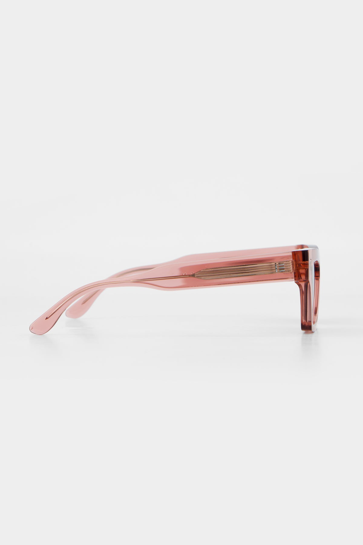 Side profile of Isle of Eden Olli sunglasses in rosewood bio-acetate, showing temple arm detail