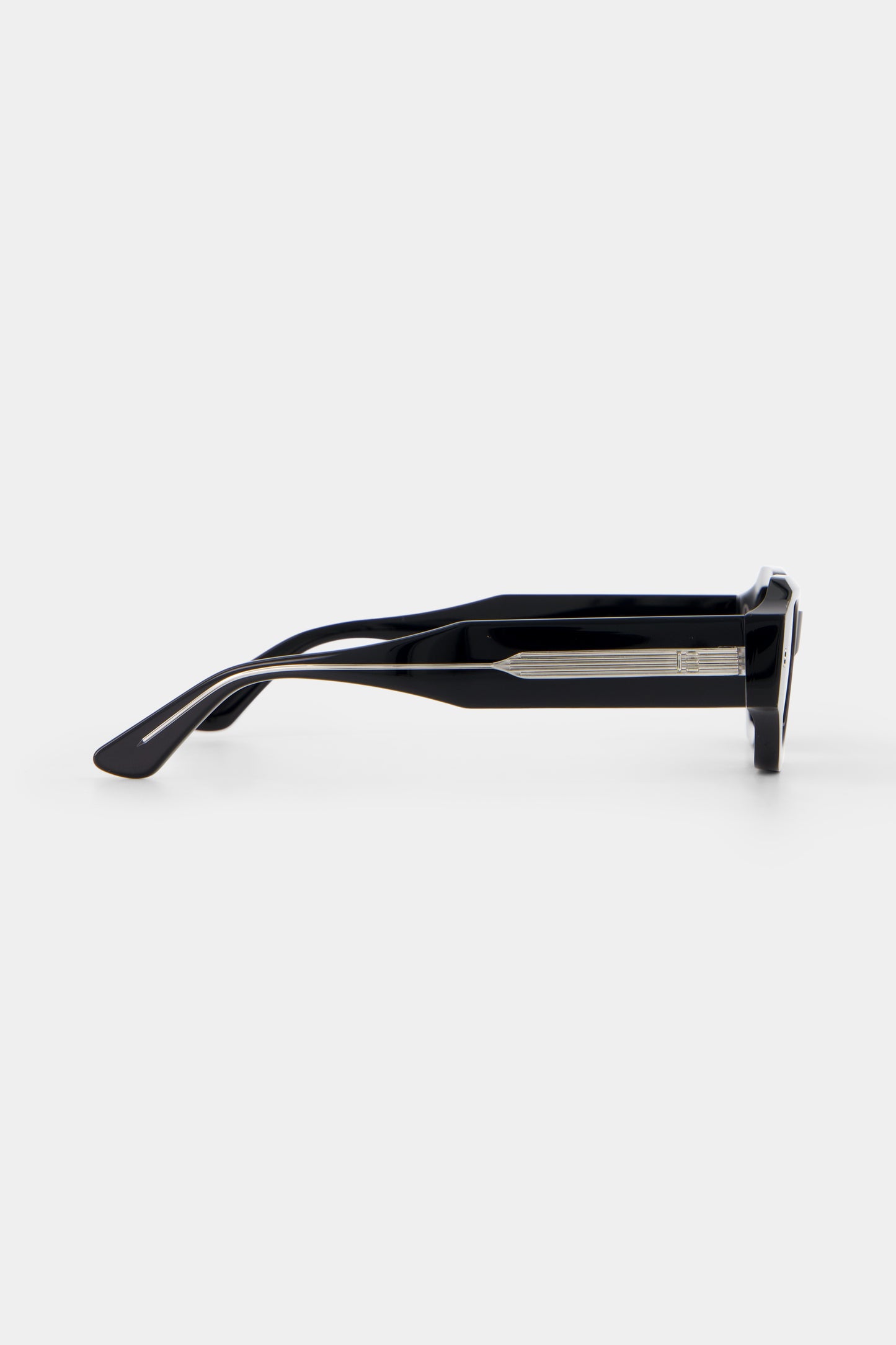 Side profile of Isle of Eden Blake Black Wire sunglasses, showing exposed wire temple arm detail