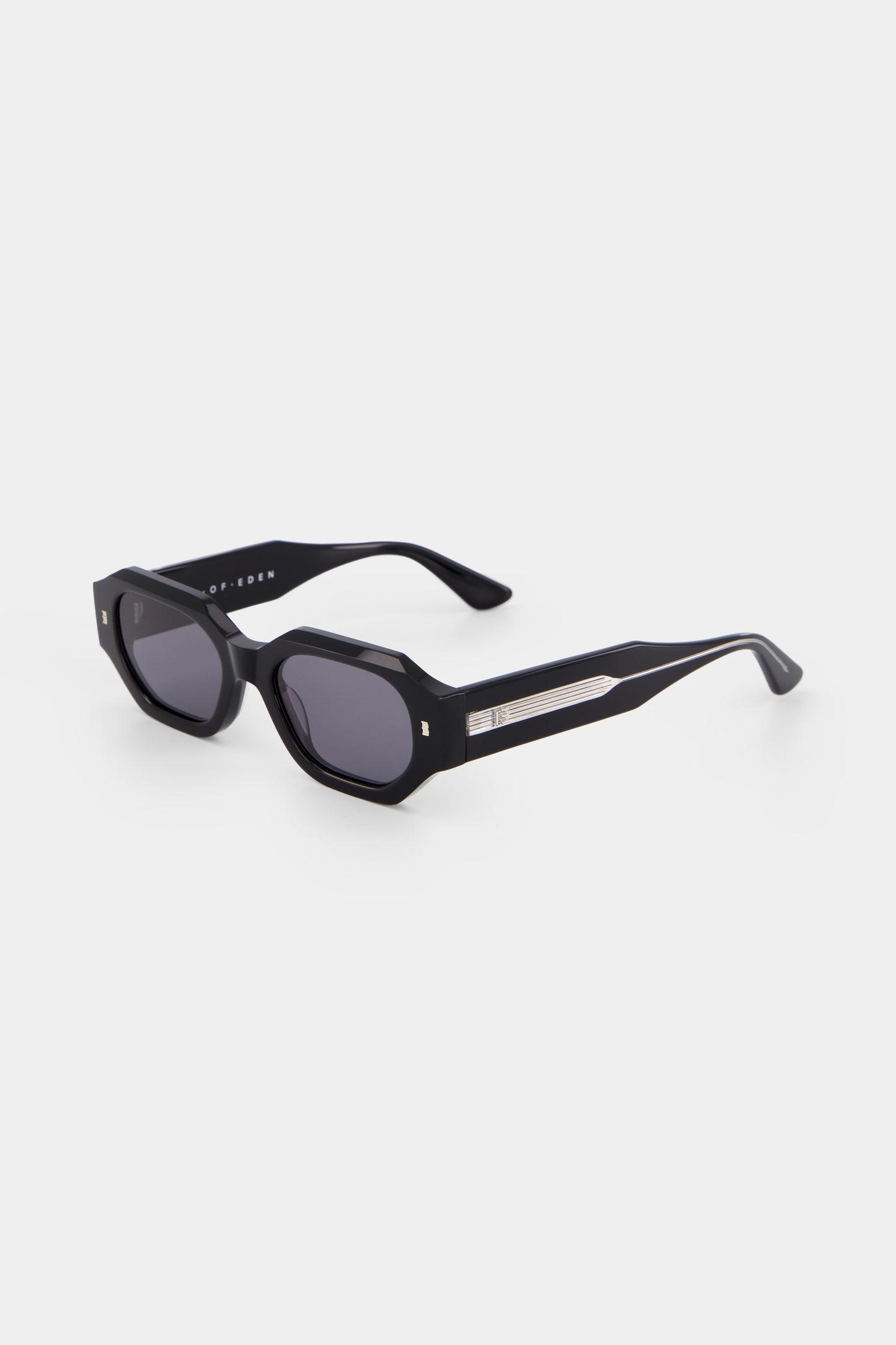Isle of Eden Blake Black Wire sunglasses, three-quarter angle showing hexagonal frame with exposed wire temple detail