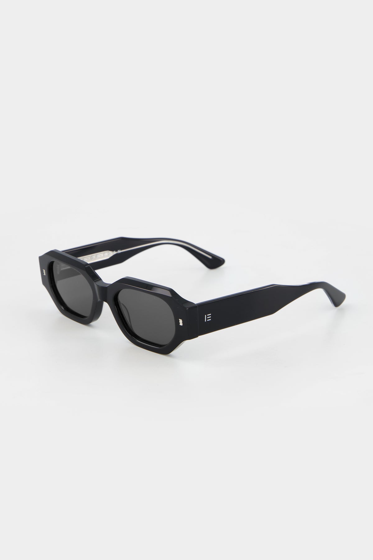 Isle of Eden Blake black sunglasses, three-quarter angle showing low profile hexagonal frame