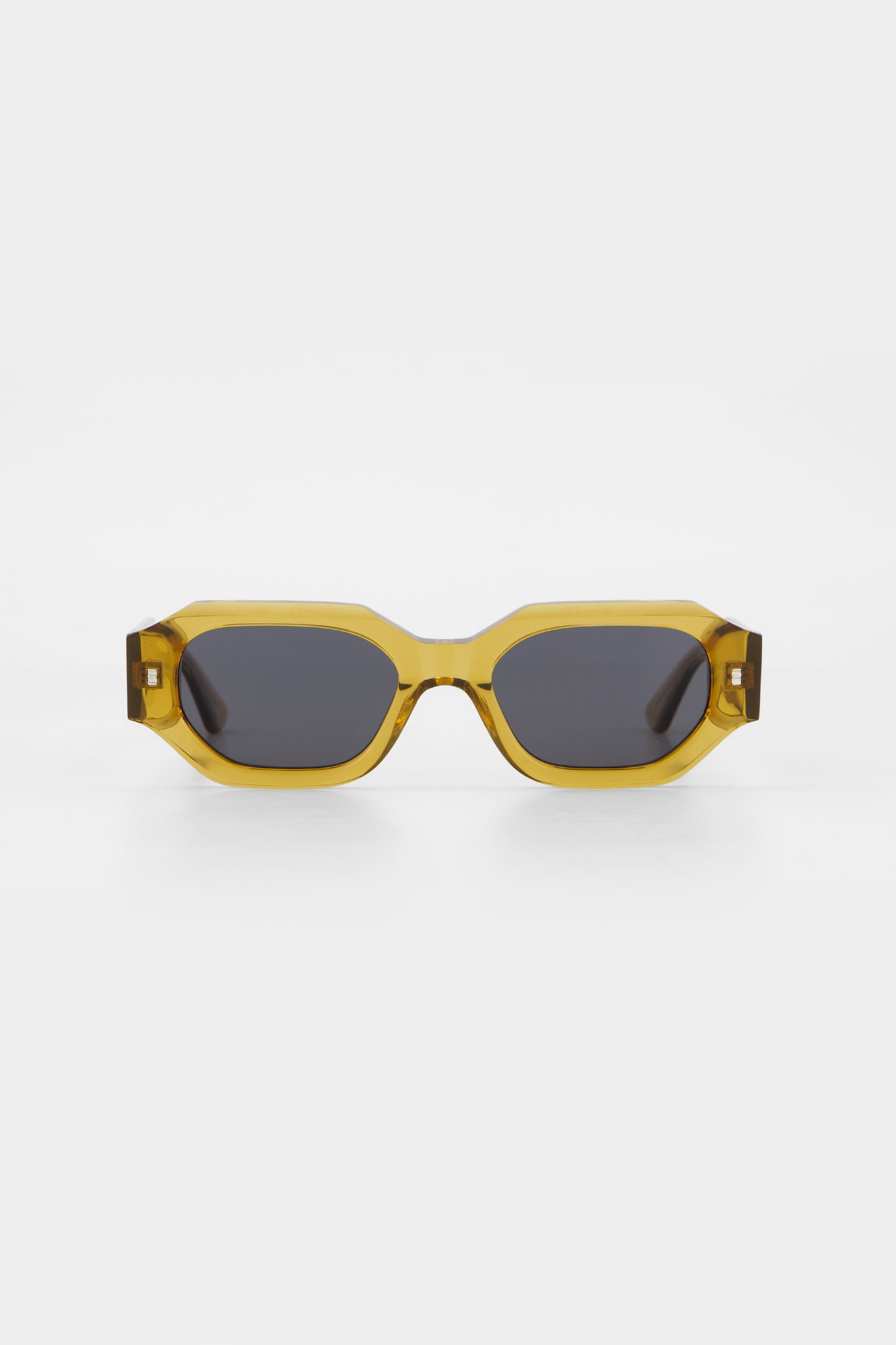 Isle of Eden Blake cognac sunglasses, front view showing hexagonal frame and grey lenses