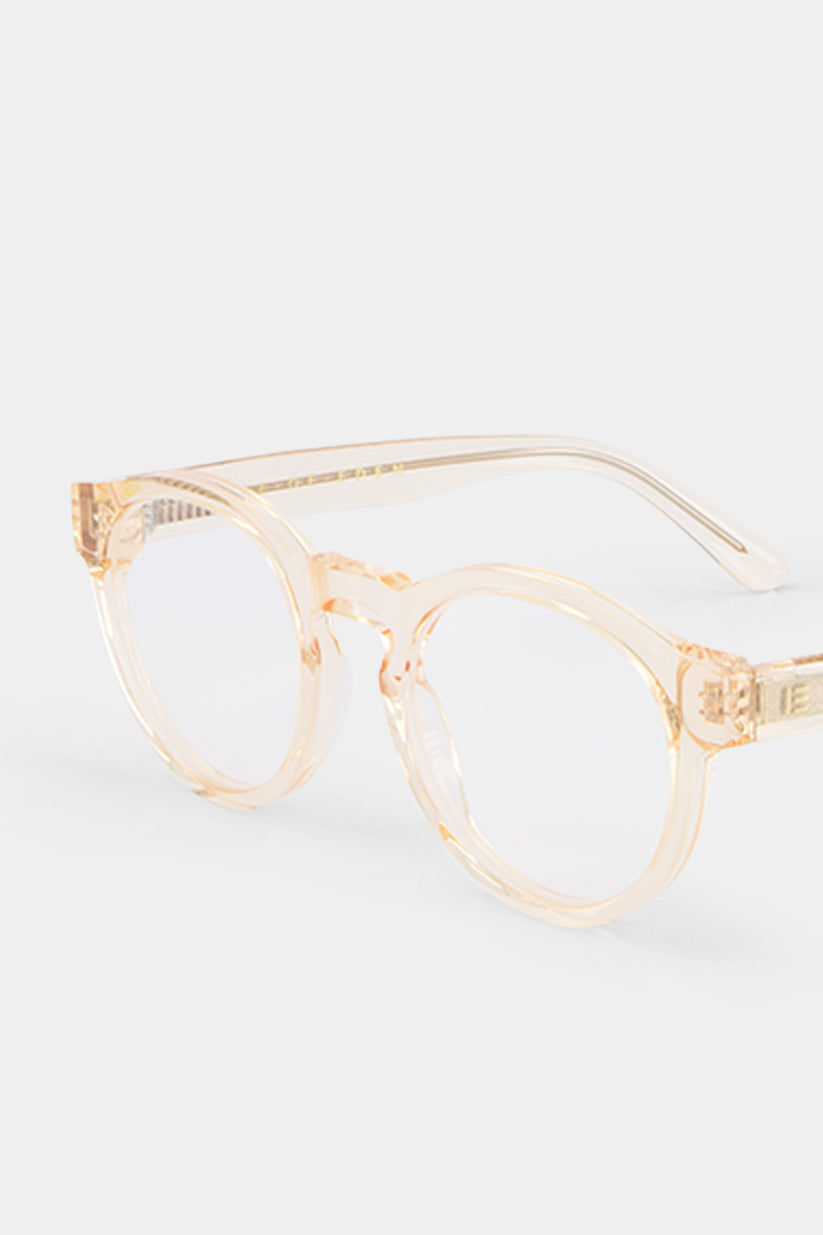 Isle of Eden Eddie prescription glasses, angled side view showing the eco-conscious champagne bio-acetate frame with brand lettering detail