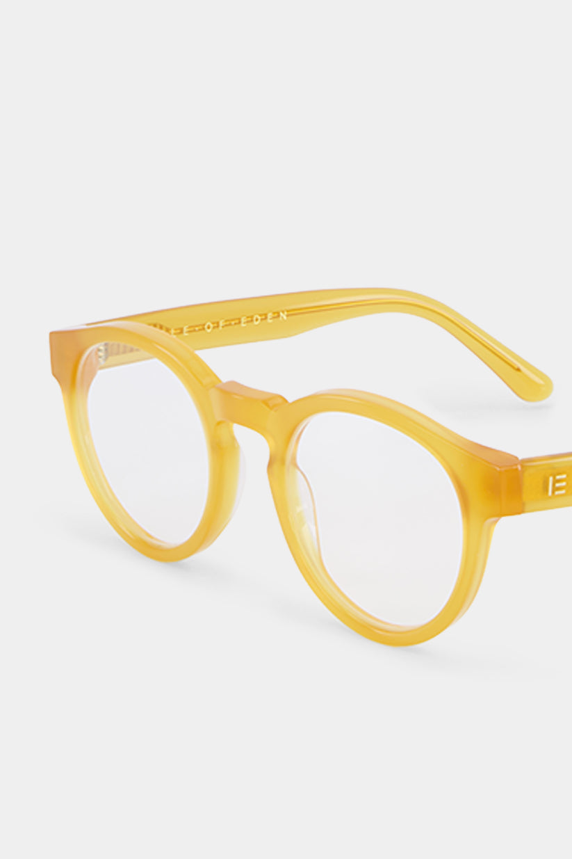 Isle of Eden Eddie prescription glasses, angled side view showing the eco-conscious yellow bio-acetate frame with brand lettering detail