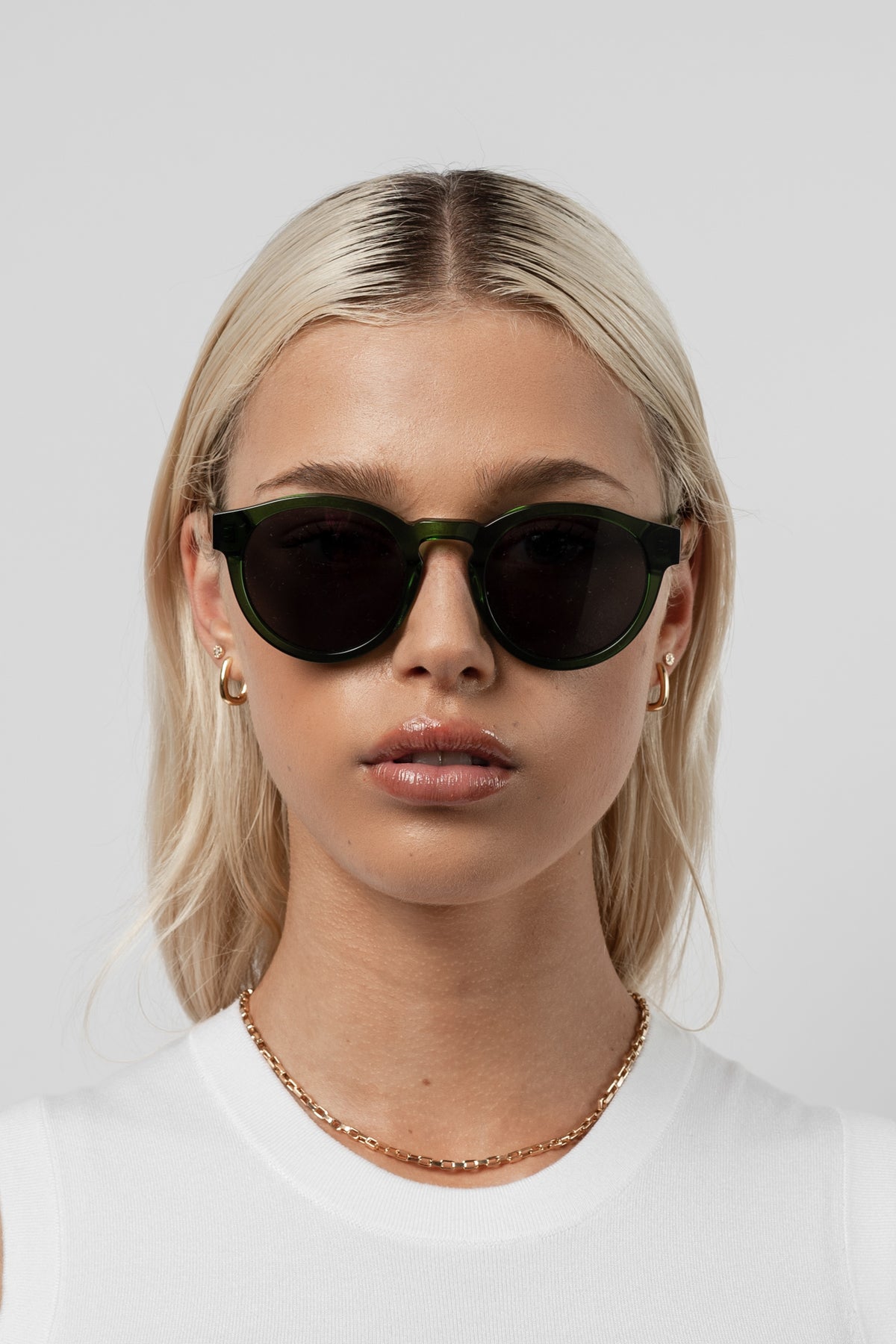 Female model wearing the classic round Isle of Eden Eddie Green Prescription eyeglasses. 