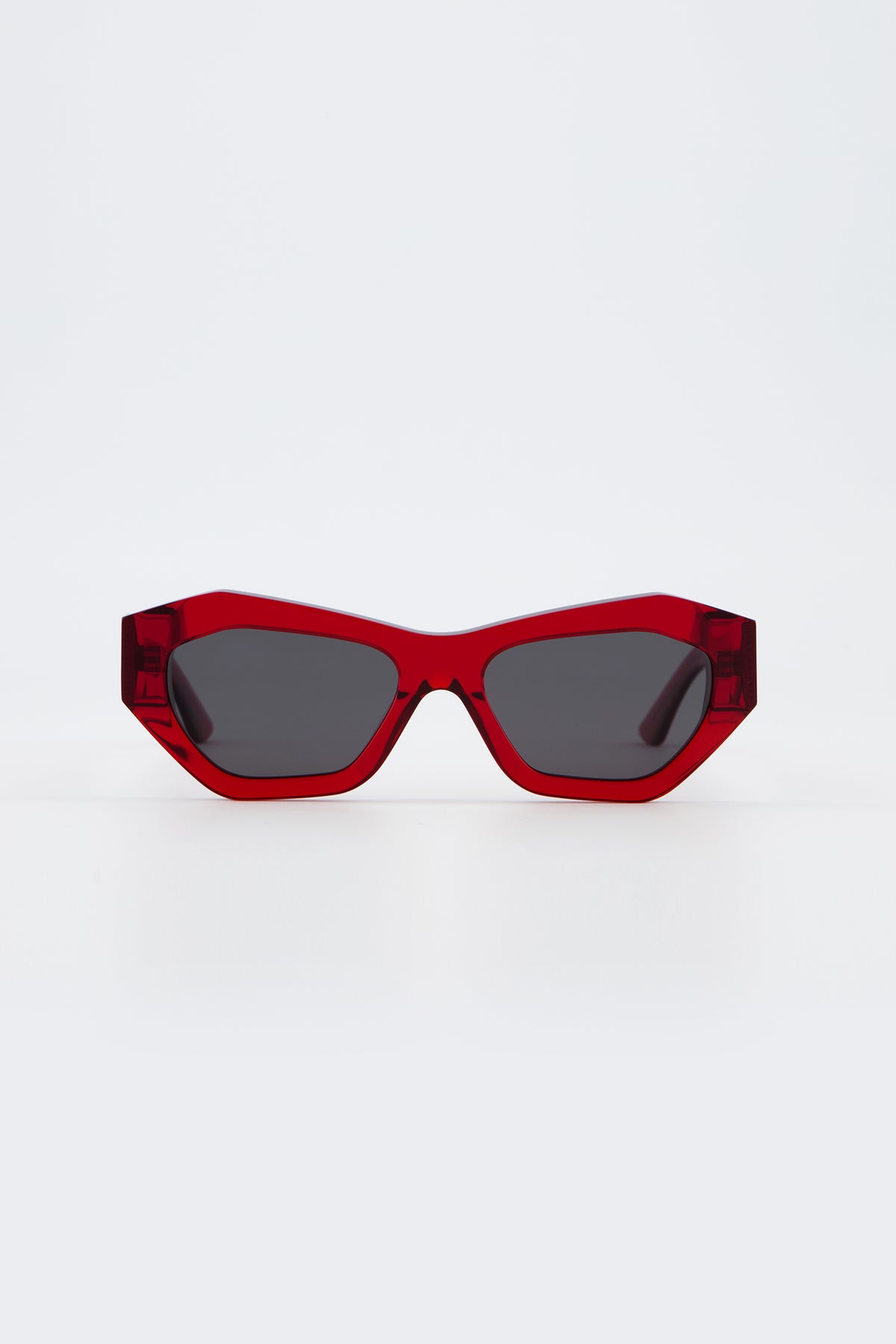 Isle of Eden Emily red sunglasses, front view showing angular cat-eye frame and dark lenses