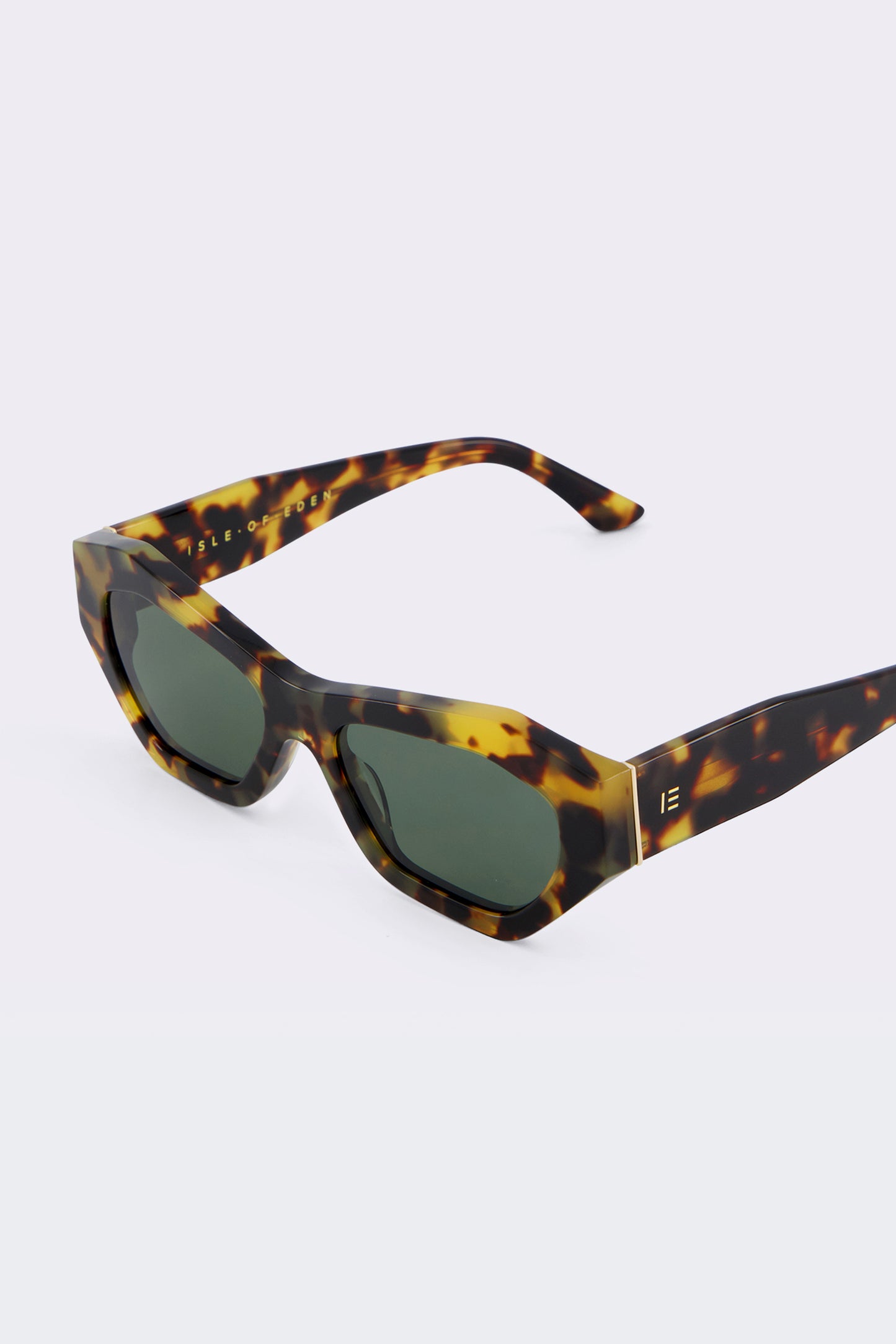 Close-up of Isle of Eden Emily tortoise sunglasses showing angular frame and brand lettering