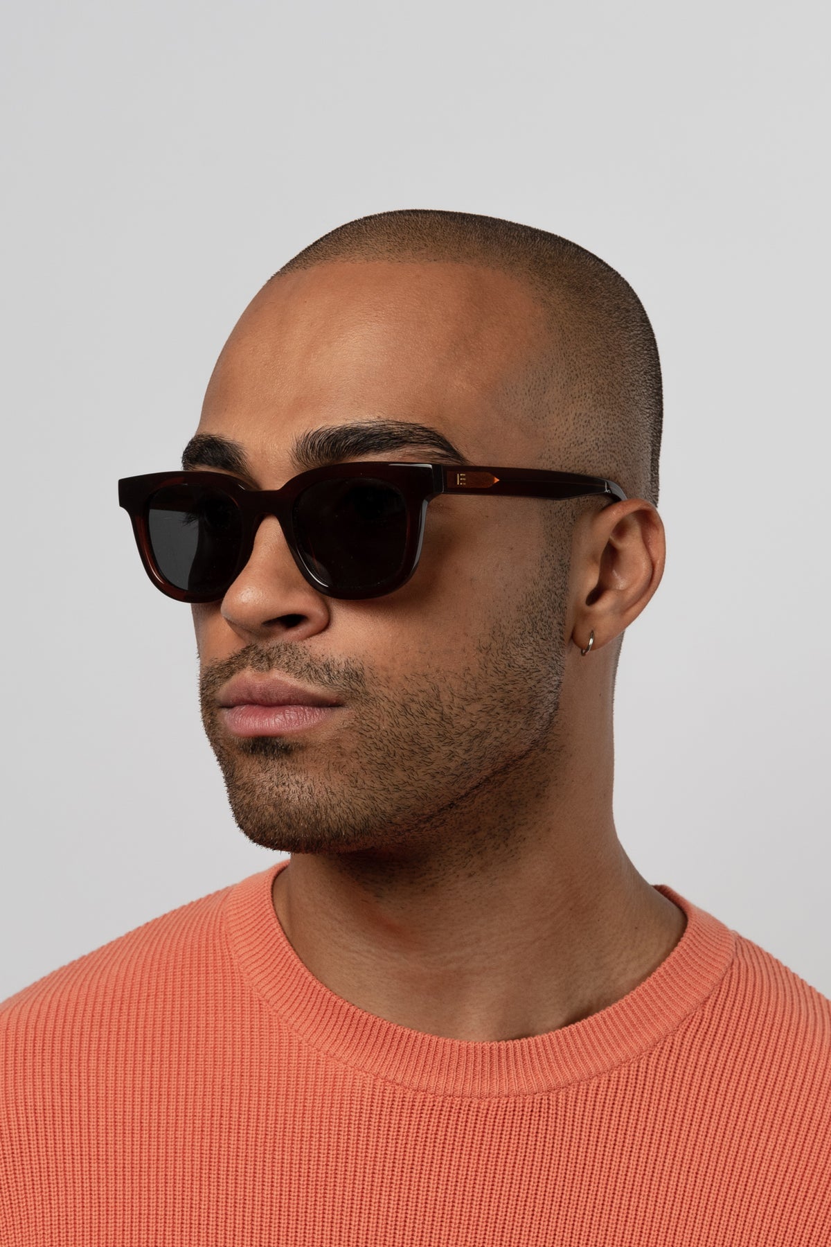 Male model wearing Isle of Eden Eugene brown sunglasses, angled portrait