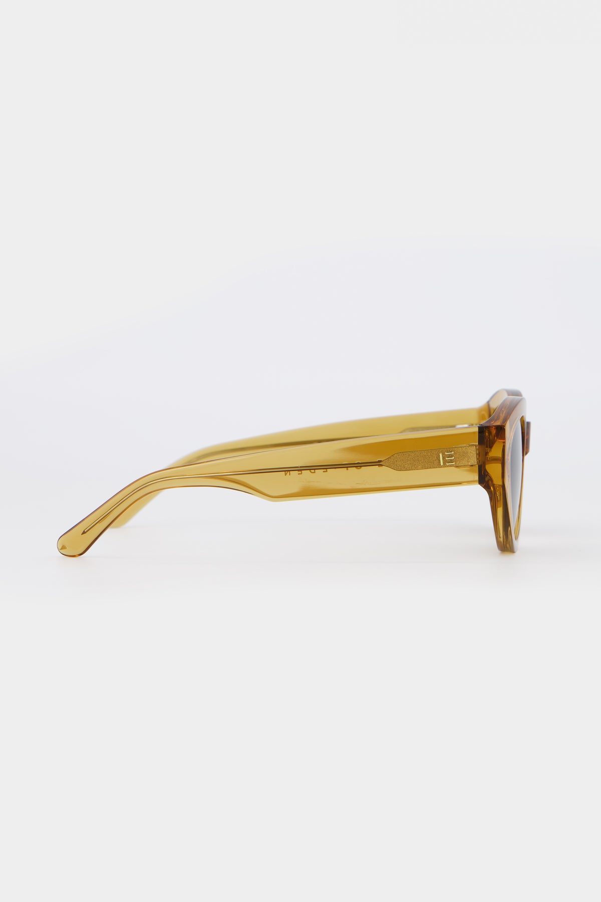 Isle of Eden Felina cognac sunglasses, side profile view showing temple length and hinge detail