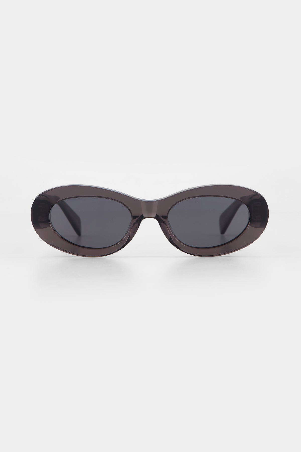 Isle of Eden Frankie grey sunglasses, front view showing curvy oval frame and dark lenses
