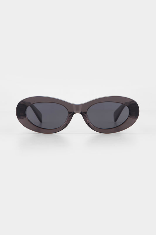 Isle of Eden Frankie grey sunglasses, front view showing curvy oval frame and dark lenses
