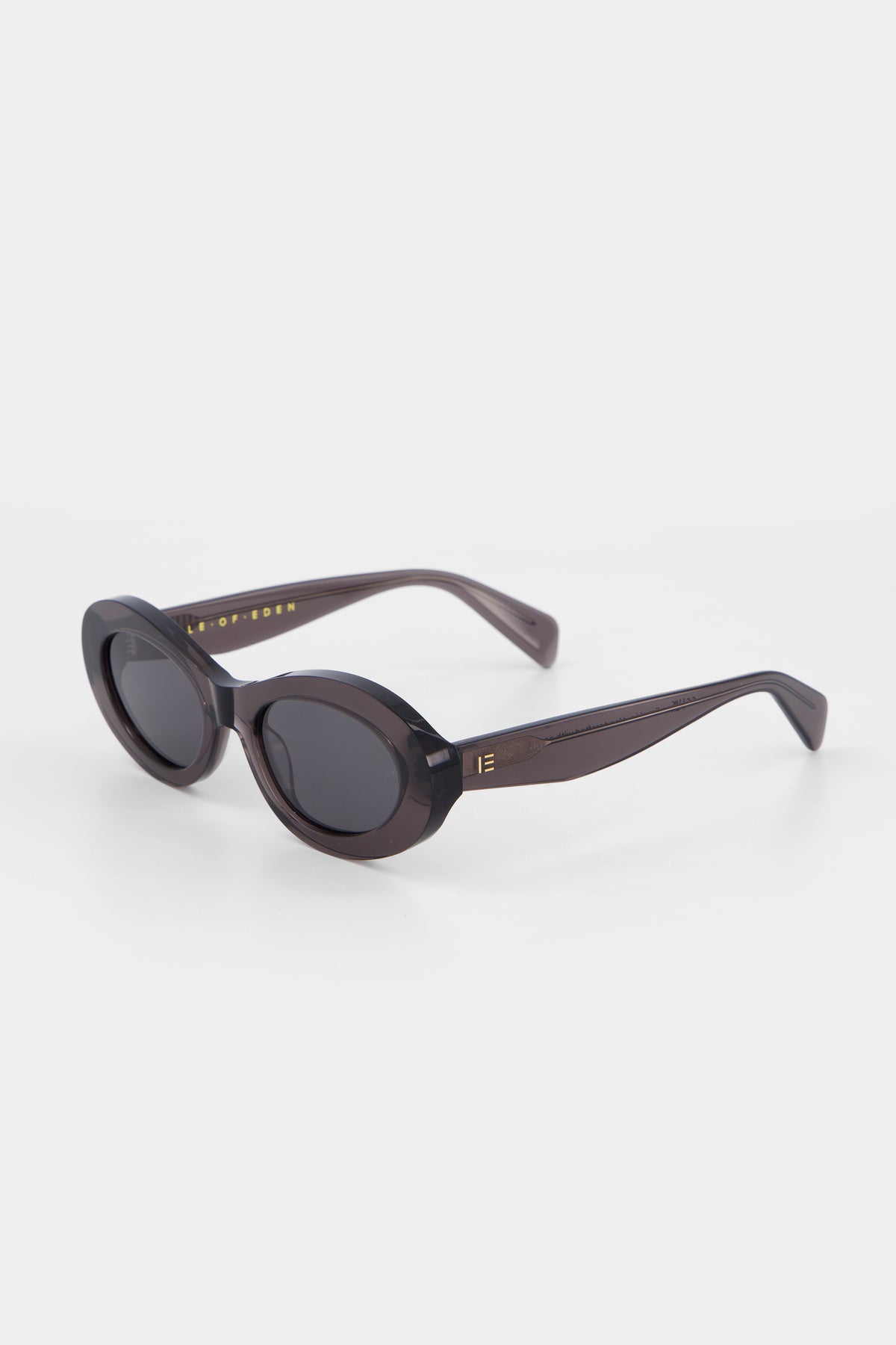 Isle of Eden Frankie grey sunglasses, three-quarter angle showing curvy oval frame