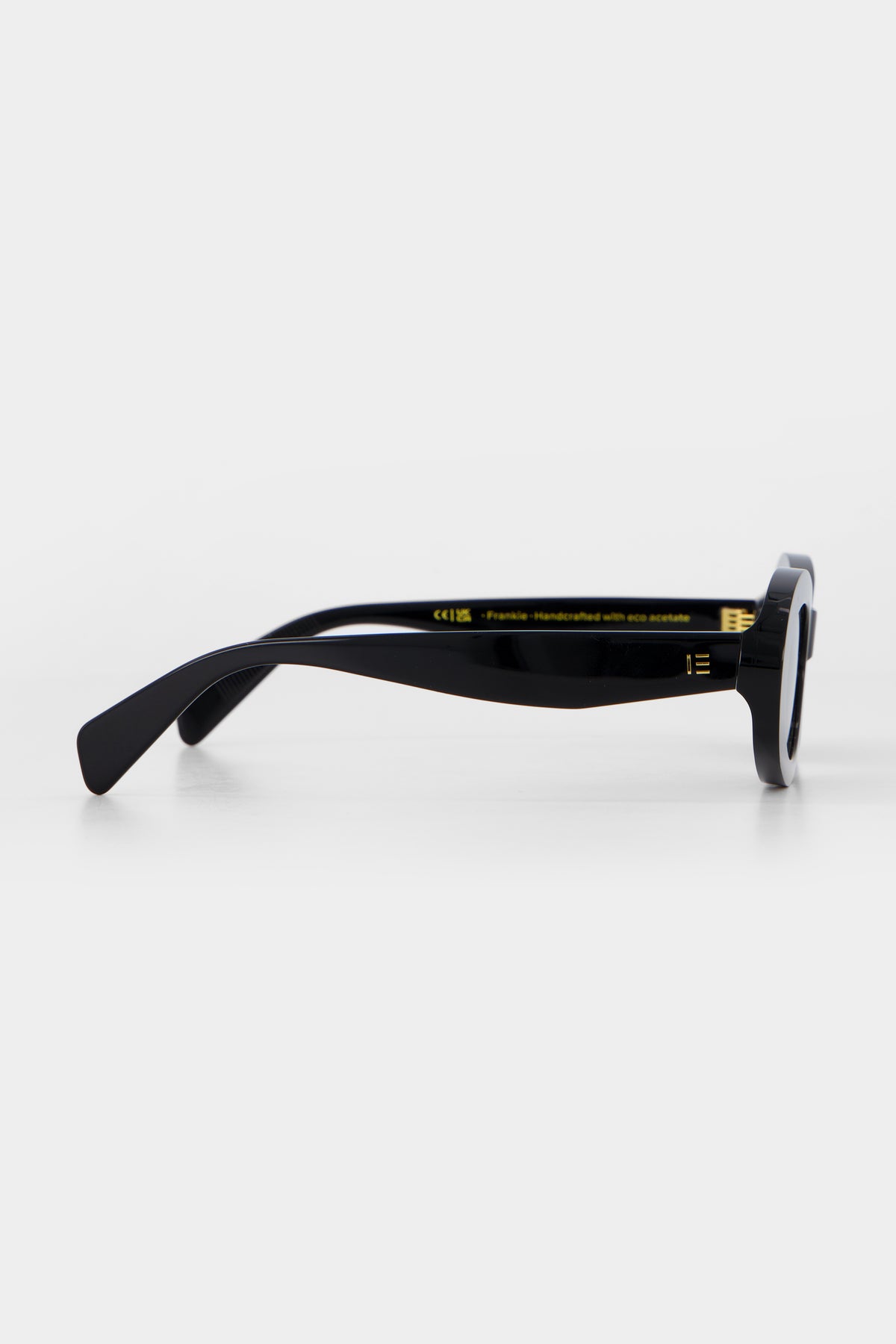Isle of Eden Frankie black sunglasses, side profile view showing temple length and hinge detail