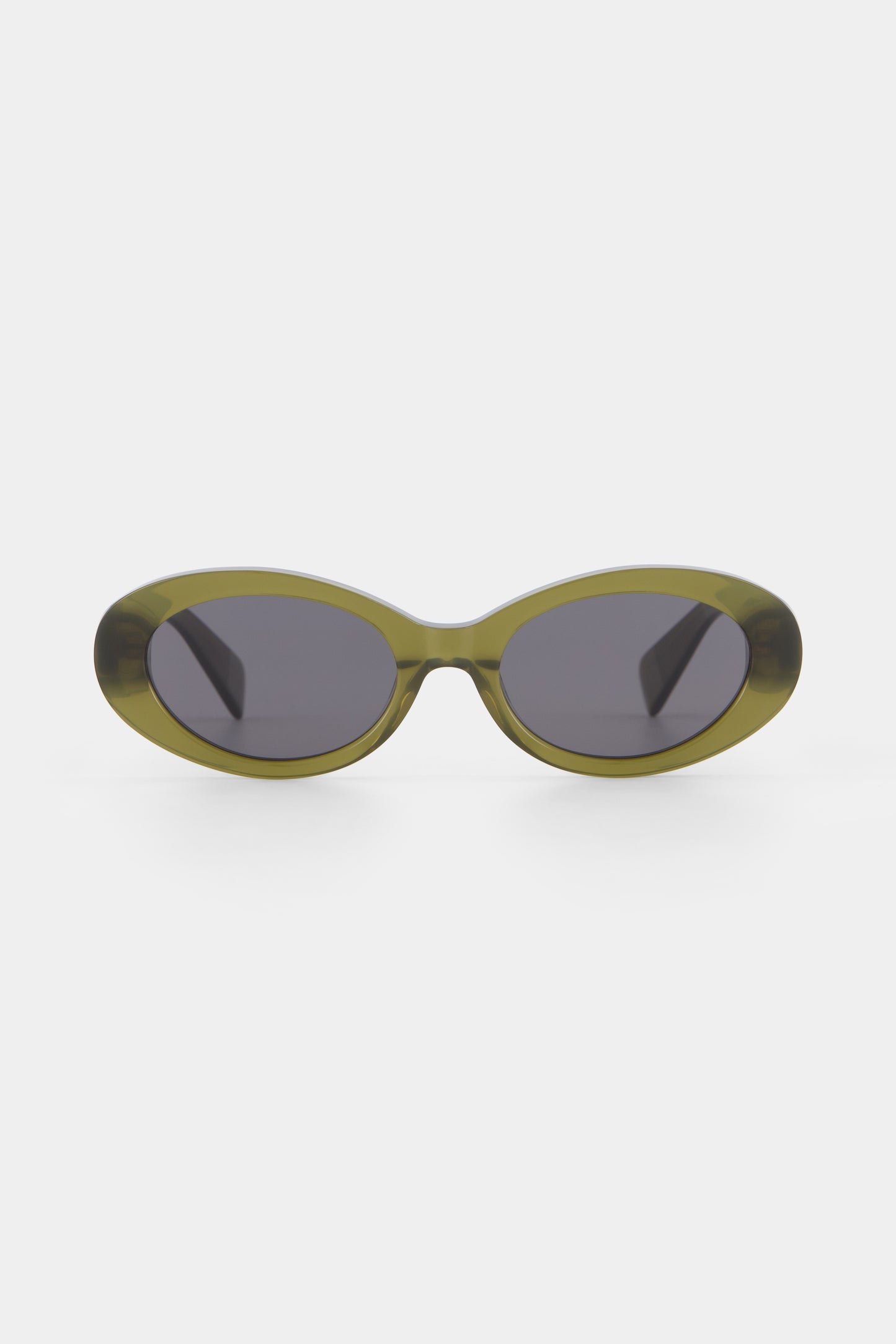 Isle of Eden Frankie frosted green sunglasses, front view showing curvy oval frame and dark lenses