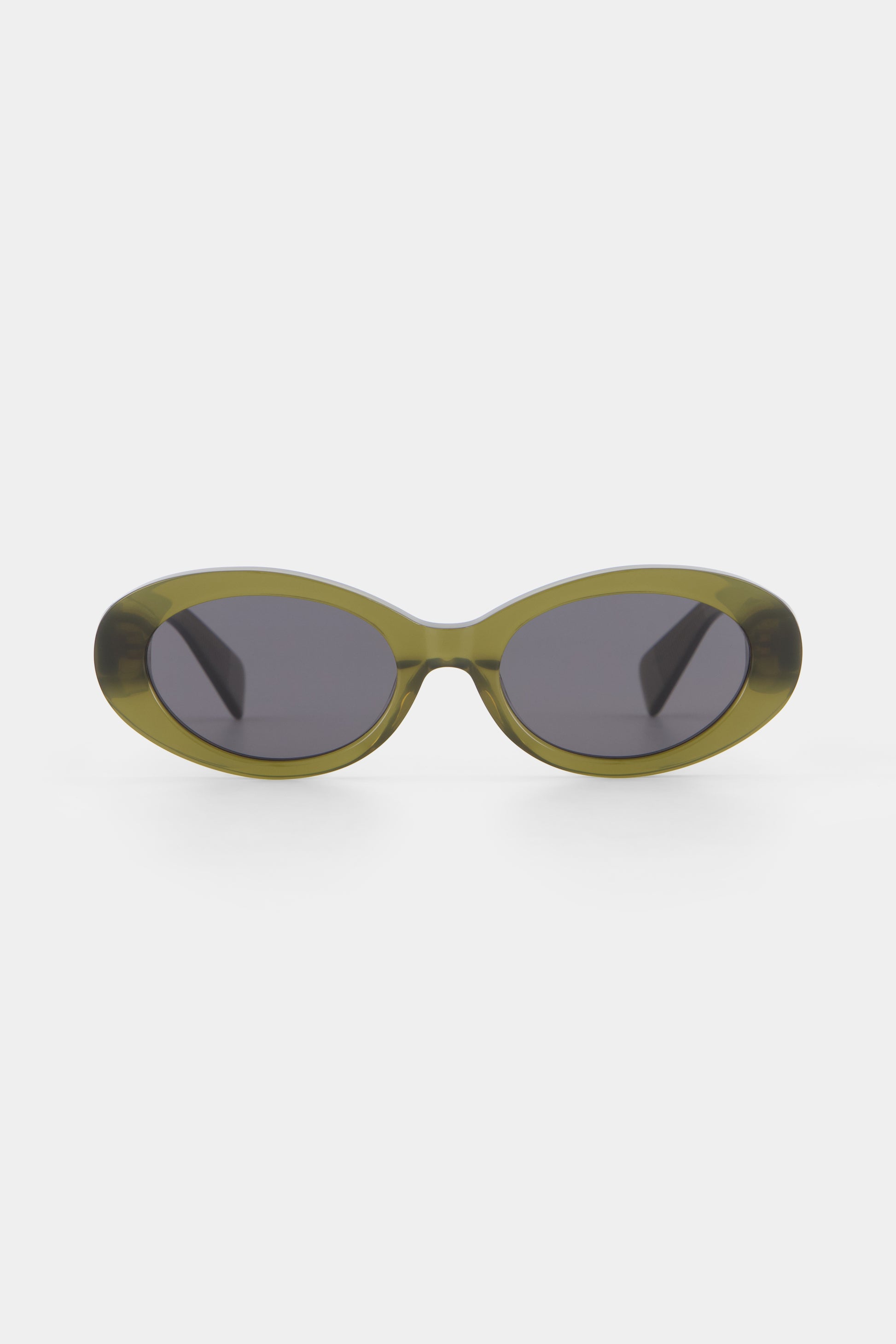 Isle of Eden Frankie frosted green sunglasses, front view showing curvy oval frame and dark lenses
