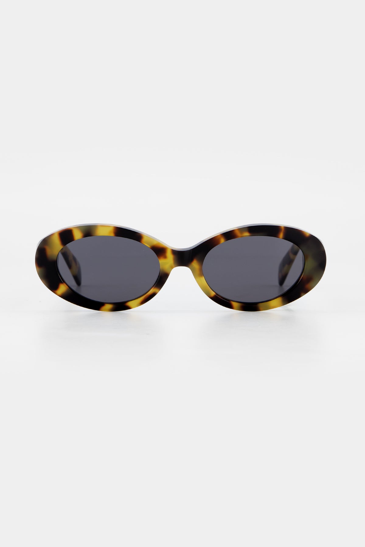 Isle of Eden Frankie tortoise sunglasses, front view showing curvy oval frame and dark lenses