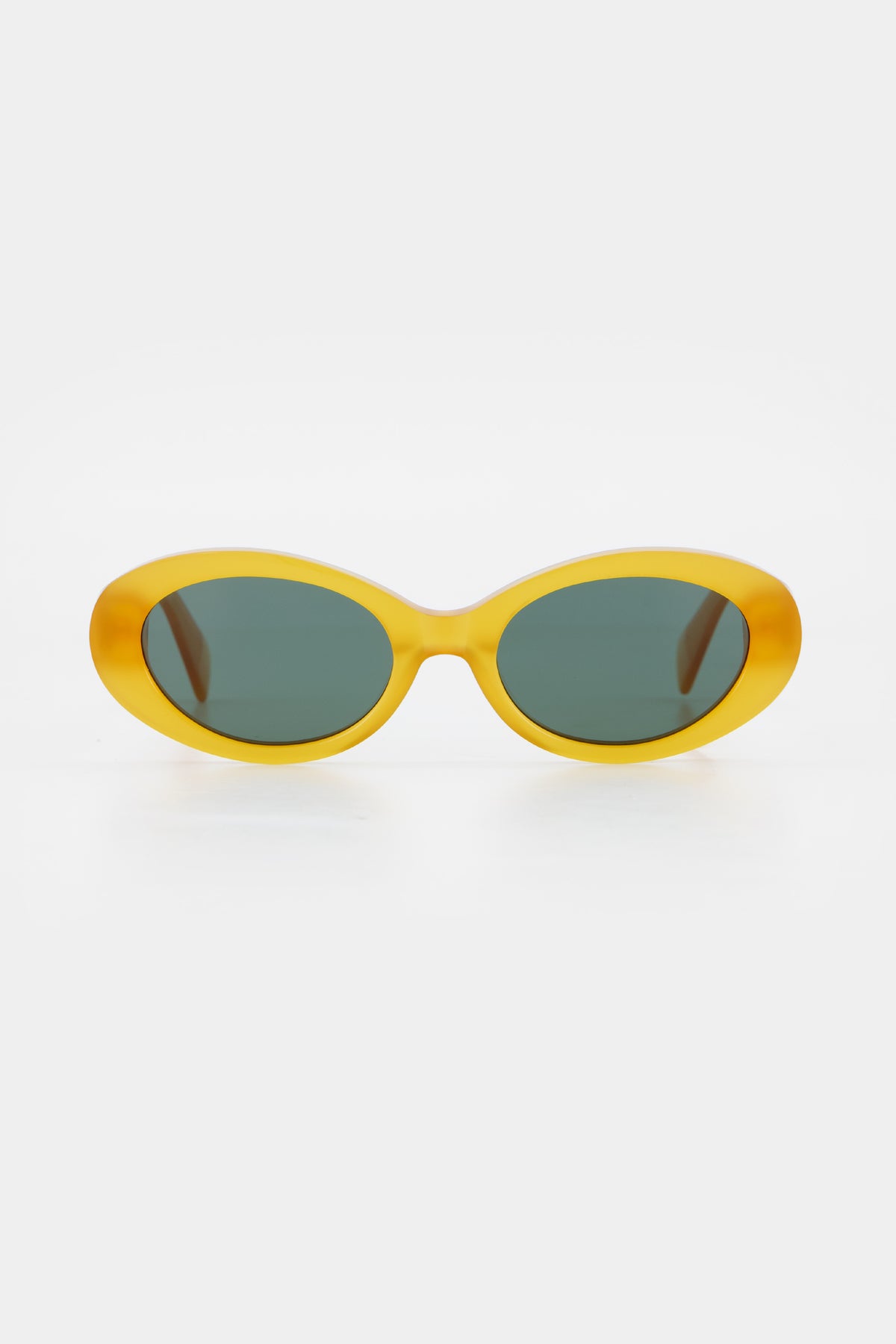 Isle of Eden Frankie yellow sunglasses, front view showing curvy oval frame and green lenses