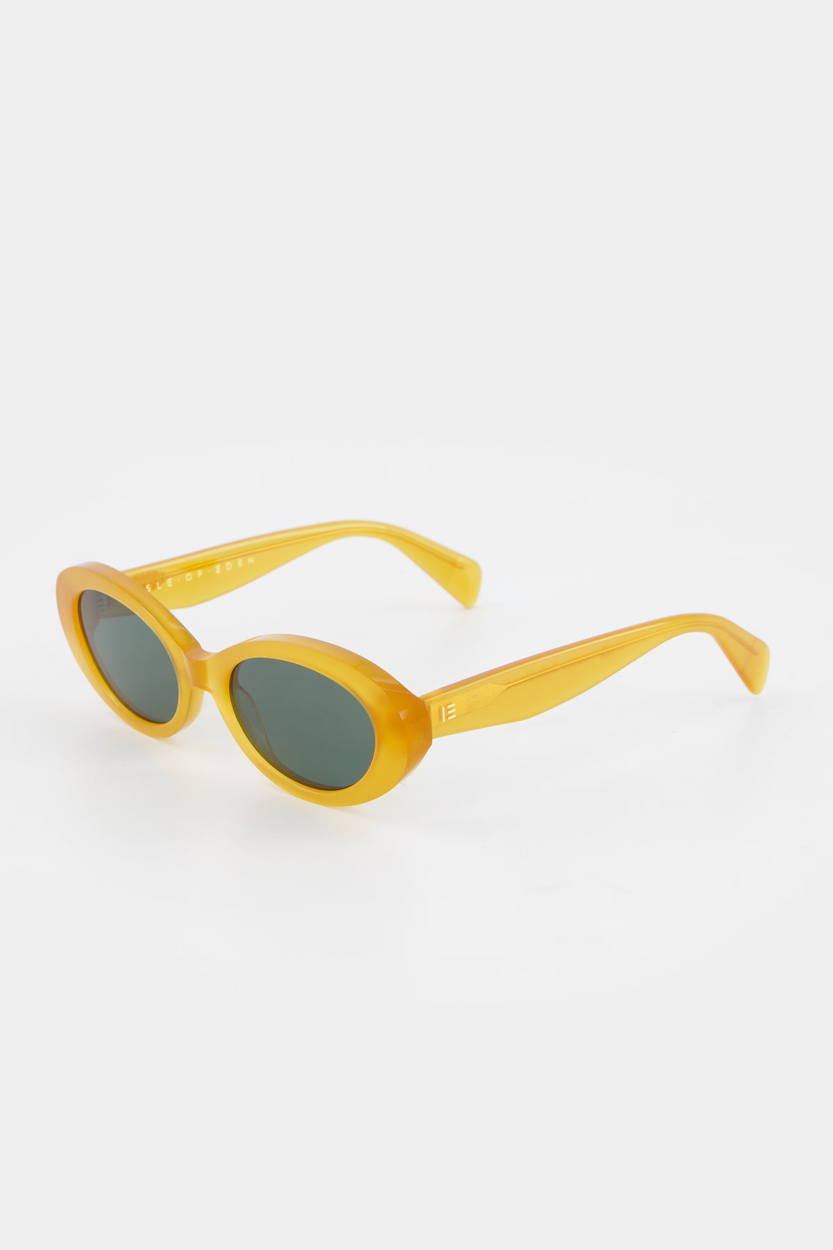 Isle of Eden Frankie yellow sunglasses, three-quarter angle showing curvy oval frame