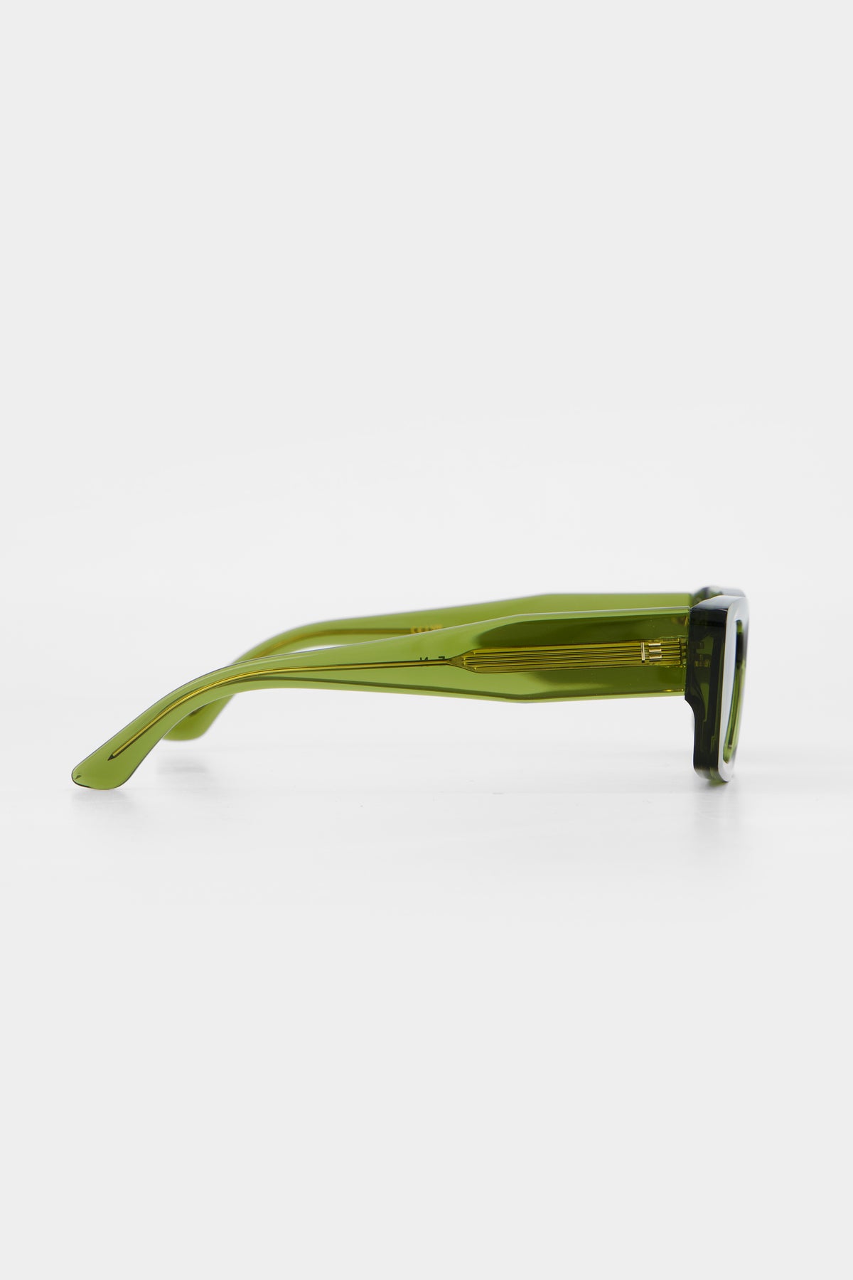 Isle of Eden Goldie green sunglasses, side profile view showing temple length and hinge detail
