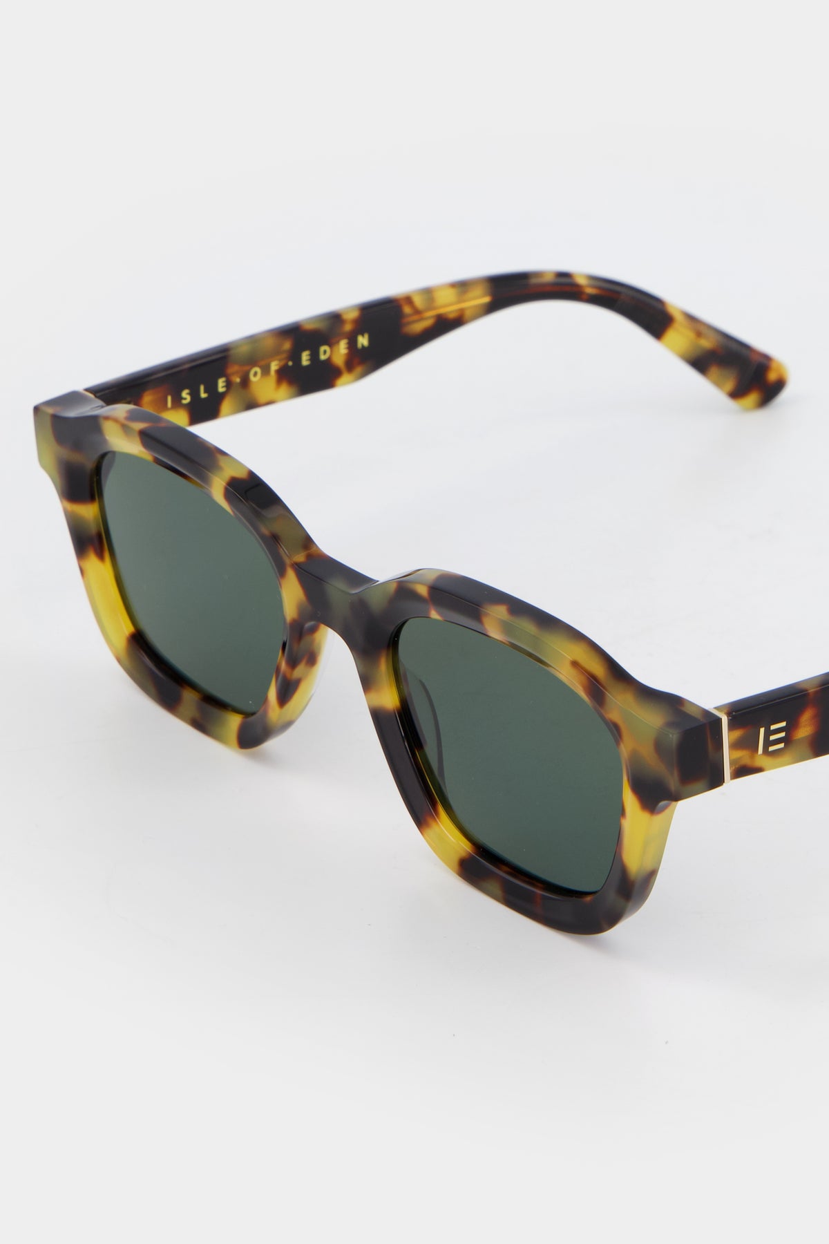 Close-up of Isle of Eden Harley tortoise sunglasses showing bold frame and brand lettering