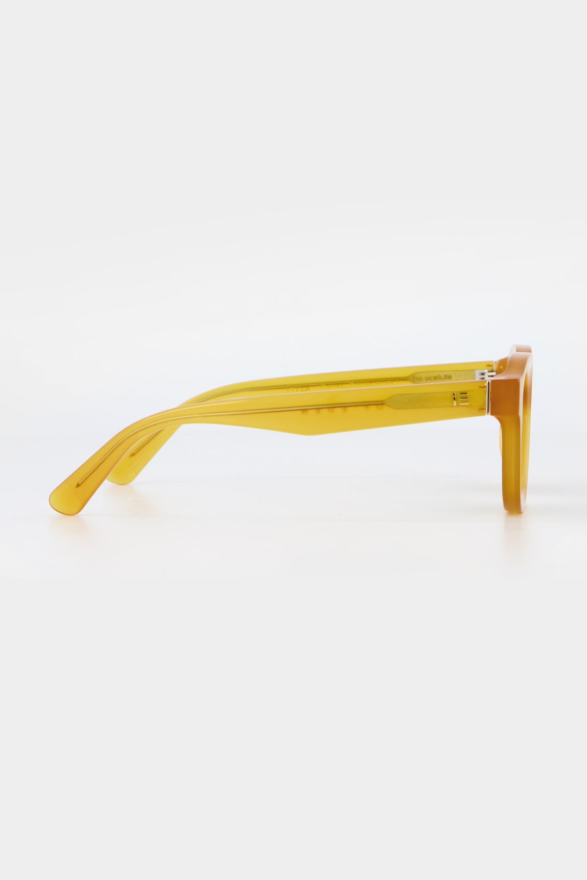Isle of Eden Harley yellow sunglasses, side profile view showing temple length and hinge detail