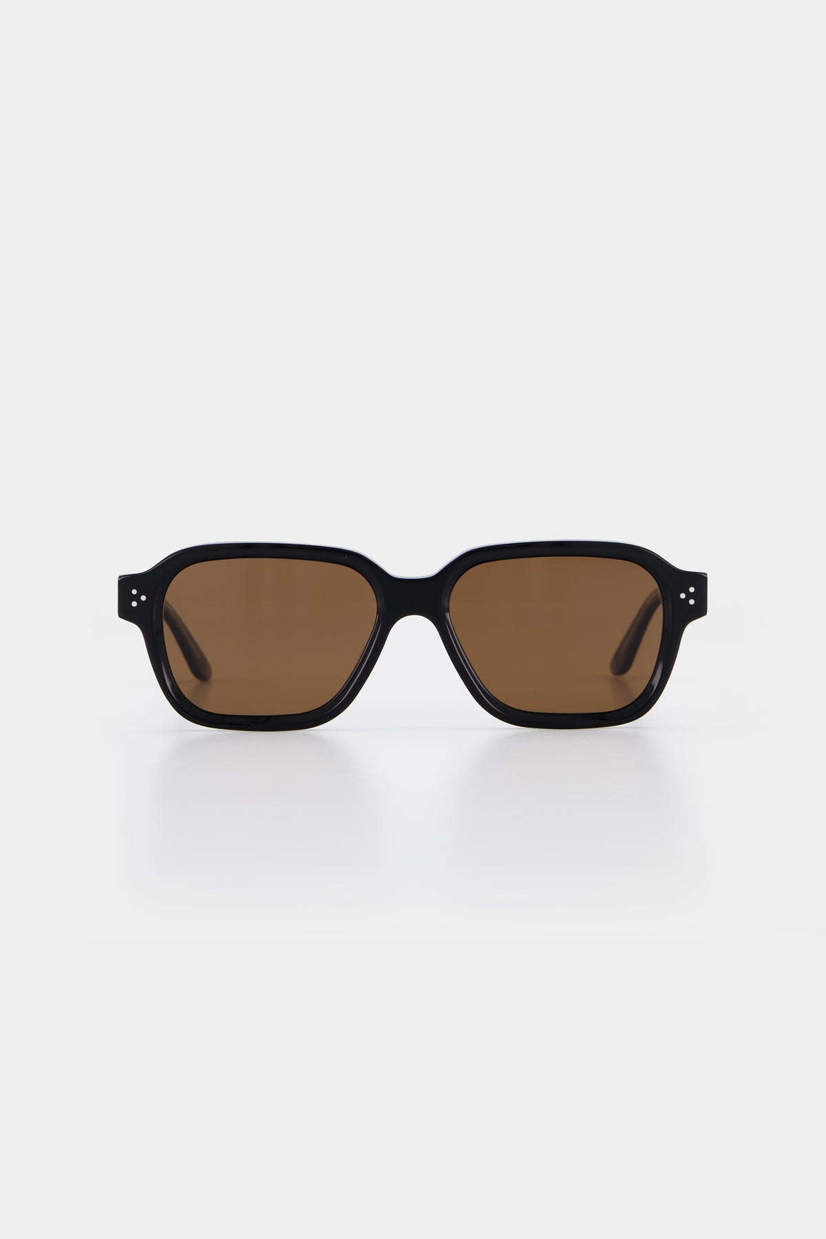 Isle of Eden Jamie black sunglasses, front view showing geometric frame and brown lenses