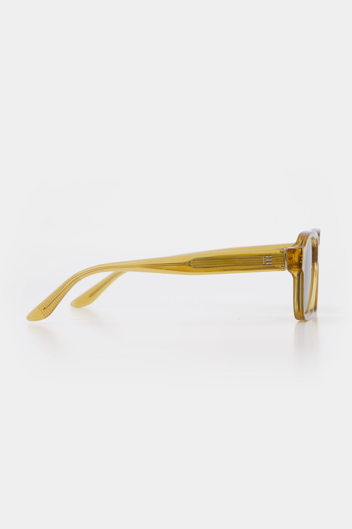 Isle of Eden Jamie cognac sunglasses, side profile view showing temple length and hinge detail
