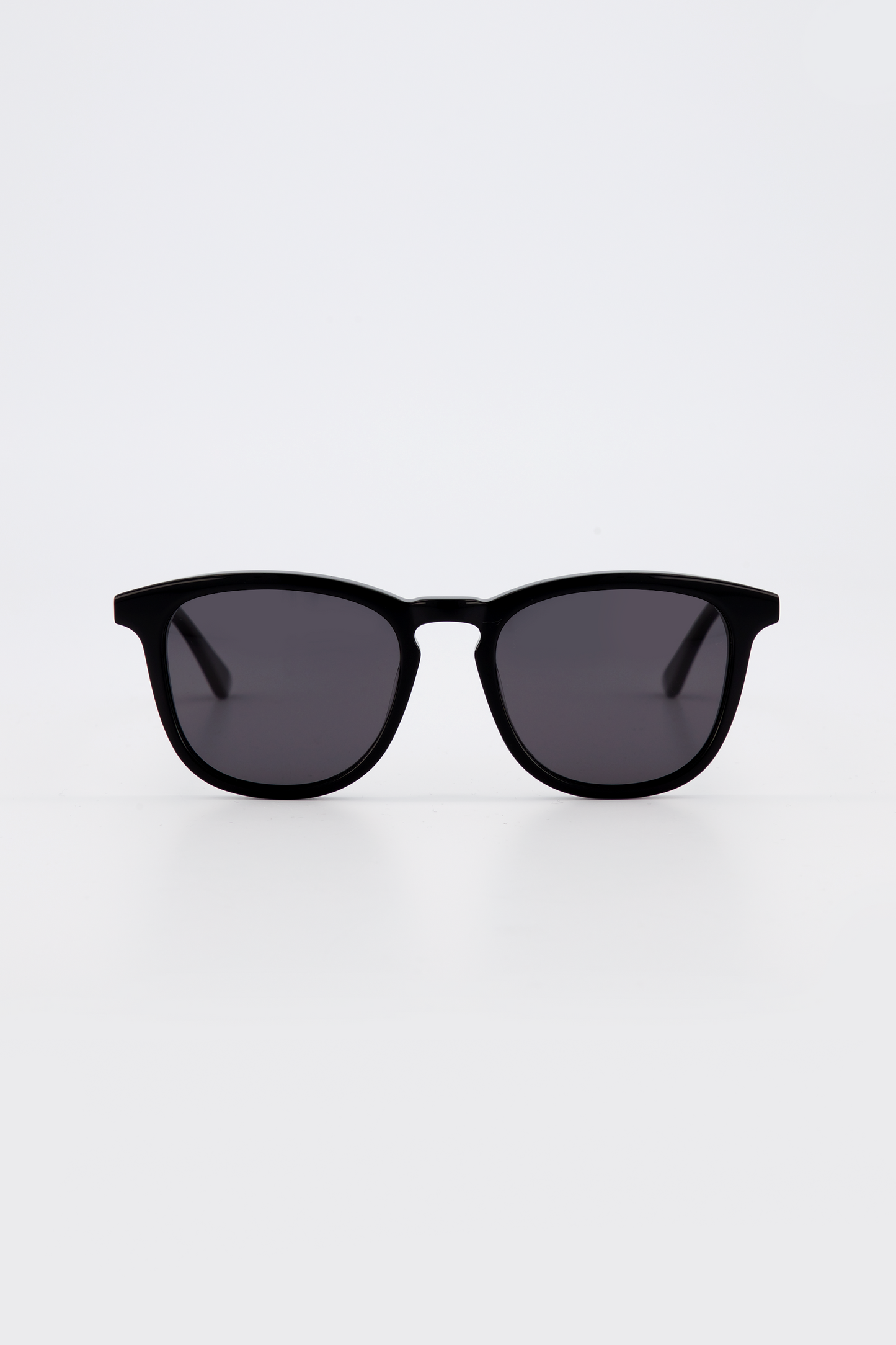 Isle of Eden Louis-Philippe black sunglasses, front view showing round bio-acetate frame and grey lenses