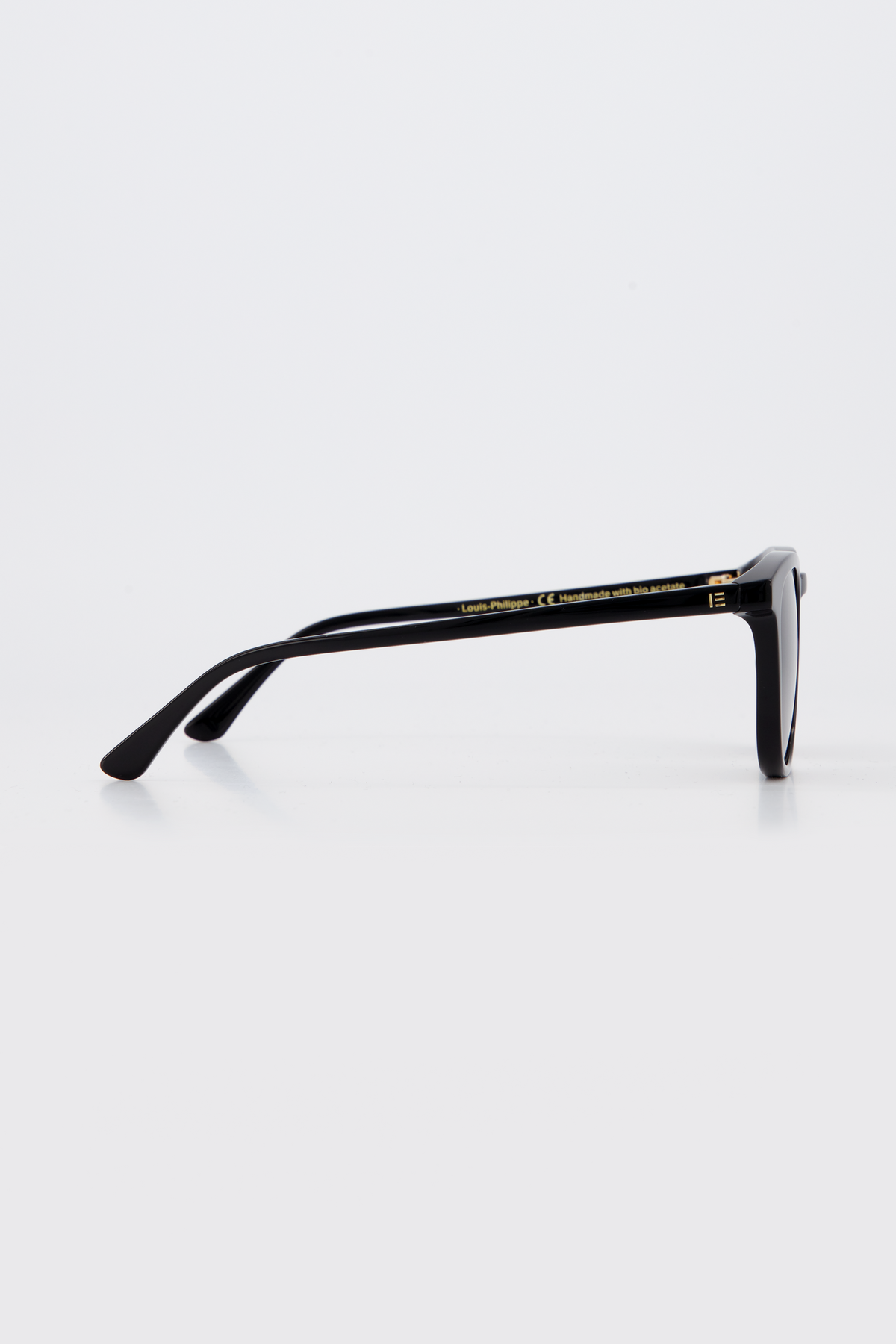 Side profile of Isle of Eden Louis-Philippe sunglasses in black bio-acetate, showing temple arm detail