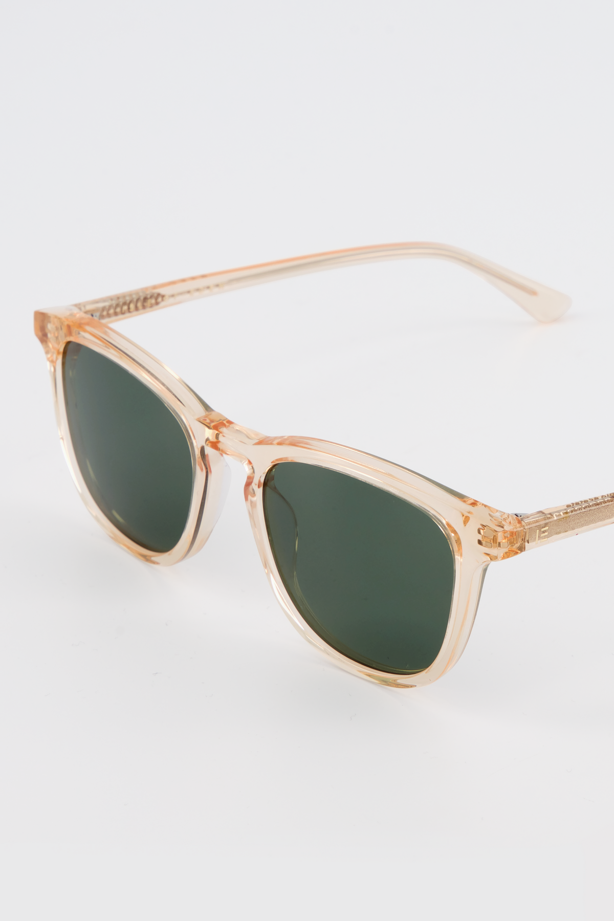 Close-up of Isle of Eden Louis-Philippe champagne sunglasses showing temple arm and hinge detail
