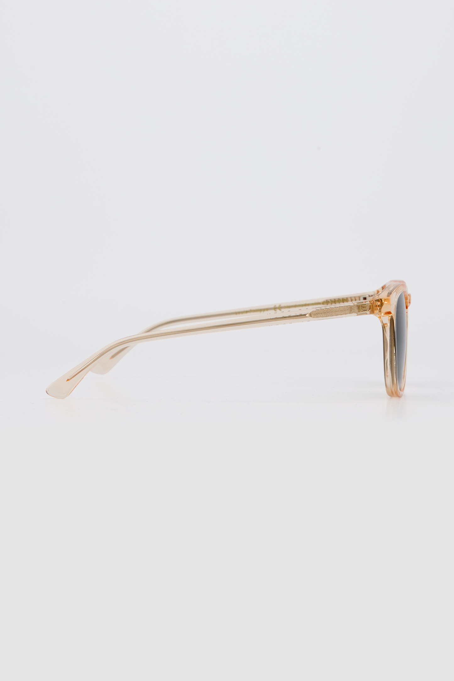 Side profile of Isle of Eden Louis-Philippe sunglasses in champagne bio-acetate, showing temple arm detail