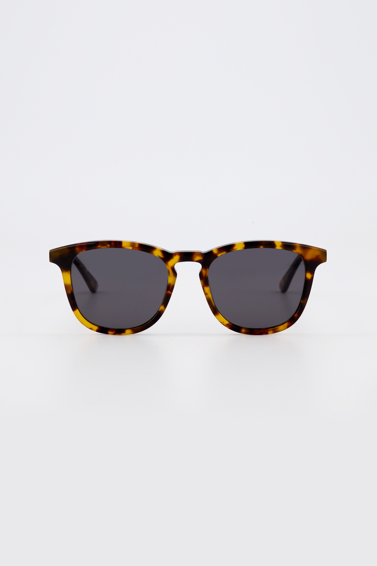 Isle of Eden Louis-Philippe tortoiseshell sunglasses, front view showing round bio-acetate frame and grey lenses