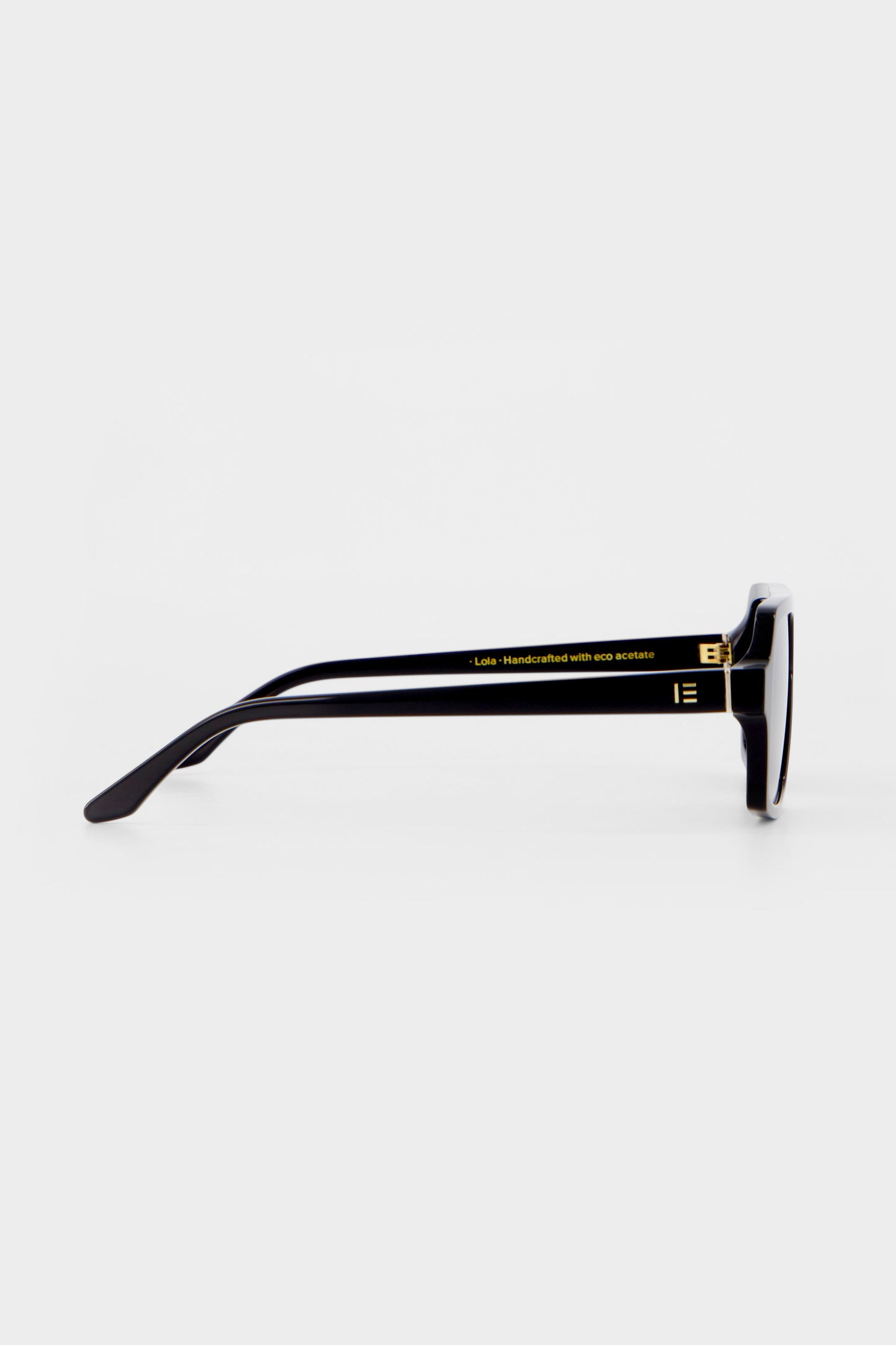 Isle of Eden Lola black sunglasses, side profile view showing temple length and hinge detail