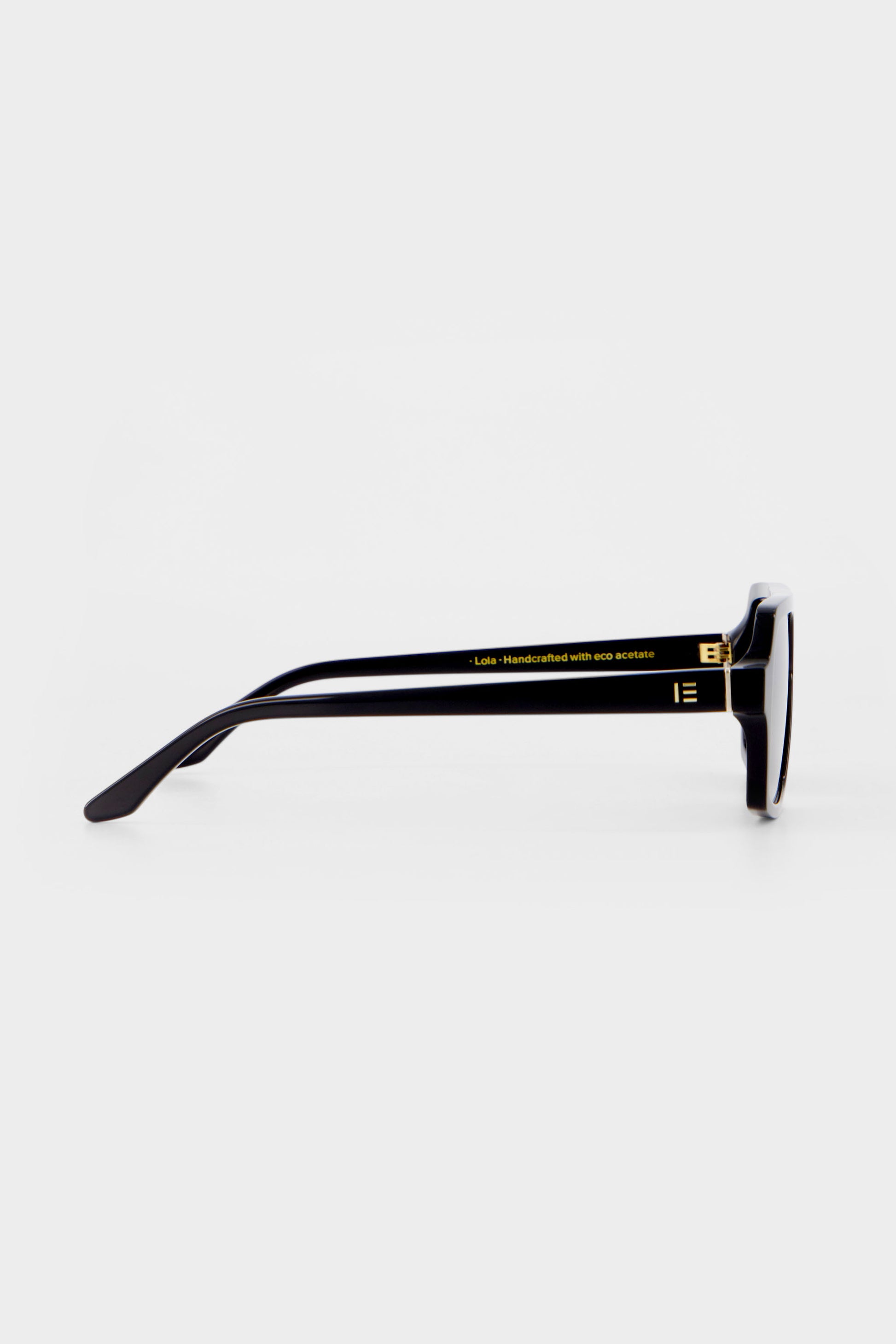 Isle of Eden Lola black sunglasses, side profile view showing temple length and hinge detail