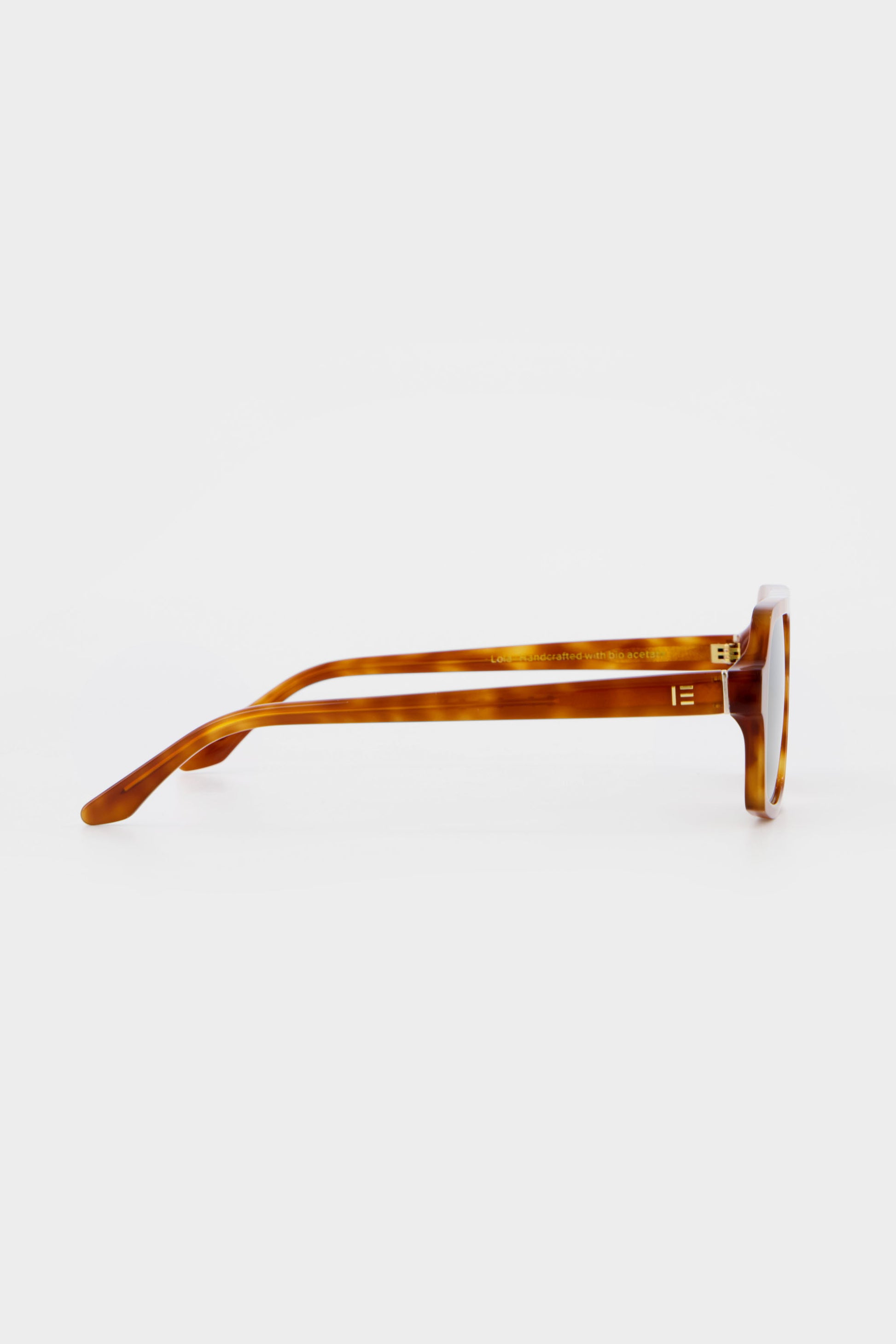 Isle of Eden Lola honey tortoise sunglasses, side profile view showing temple length and hinge detail