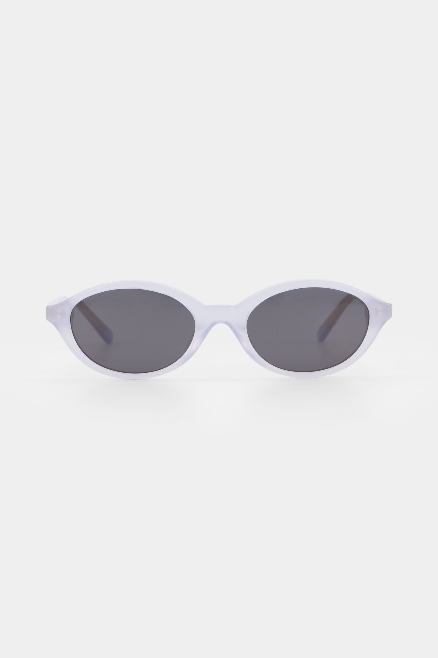 Isle of Eden Mirabel baby blue sunglasses, front view showing sleek oval frame and dark lenses
