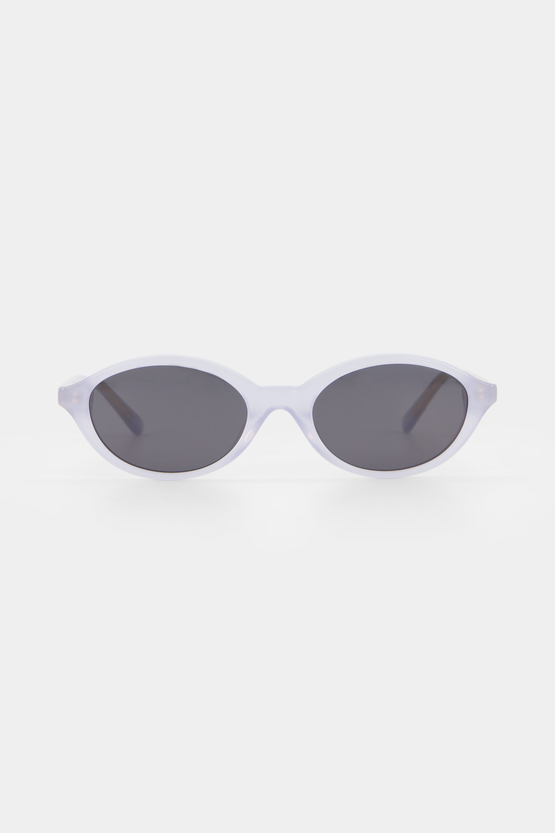 Isle of Eden Mirabel baby blue sunglasses, front view showing sleek oval frame and dark lenses