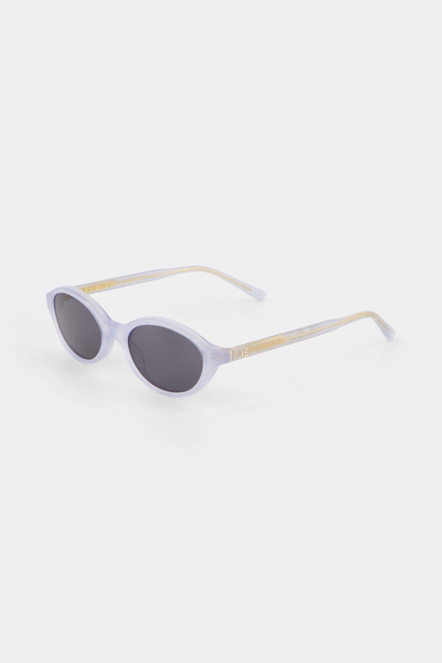 Isle of Eden Mirabel baby blue sunglasses, three-quarter angle showing sleek oval frame