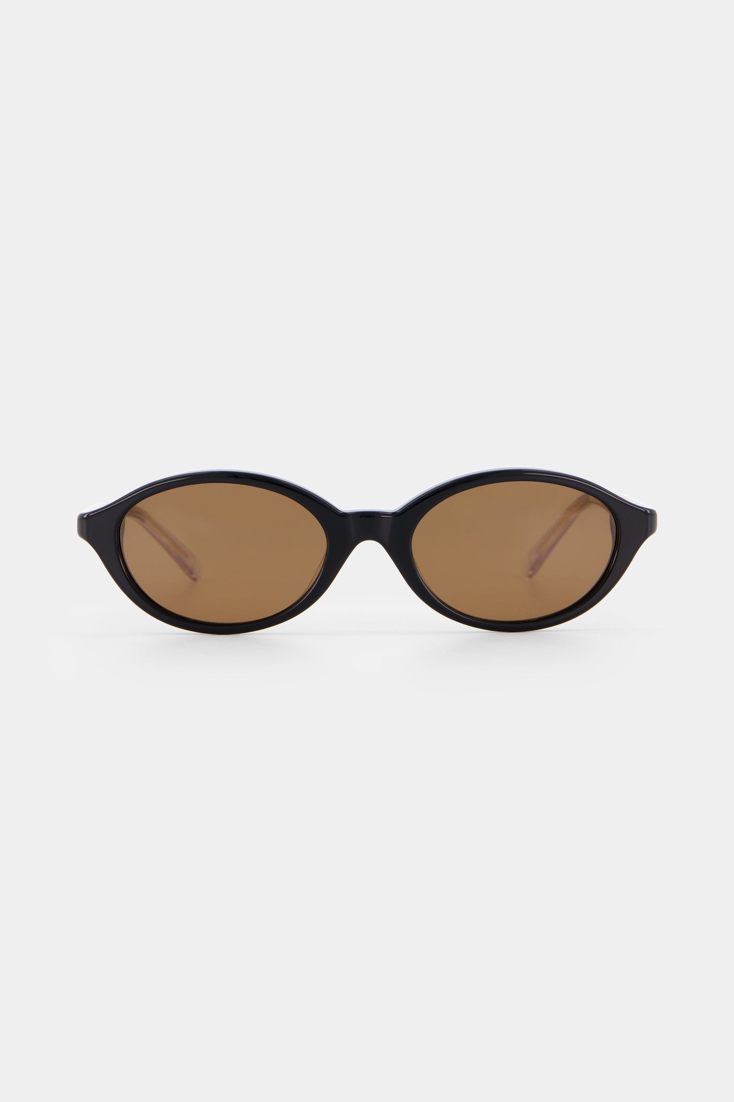 Isle of Eden Mirabel black sunglasses, front view showing sleek oval frame and brown lenses