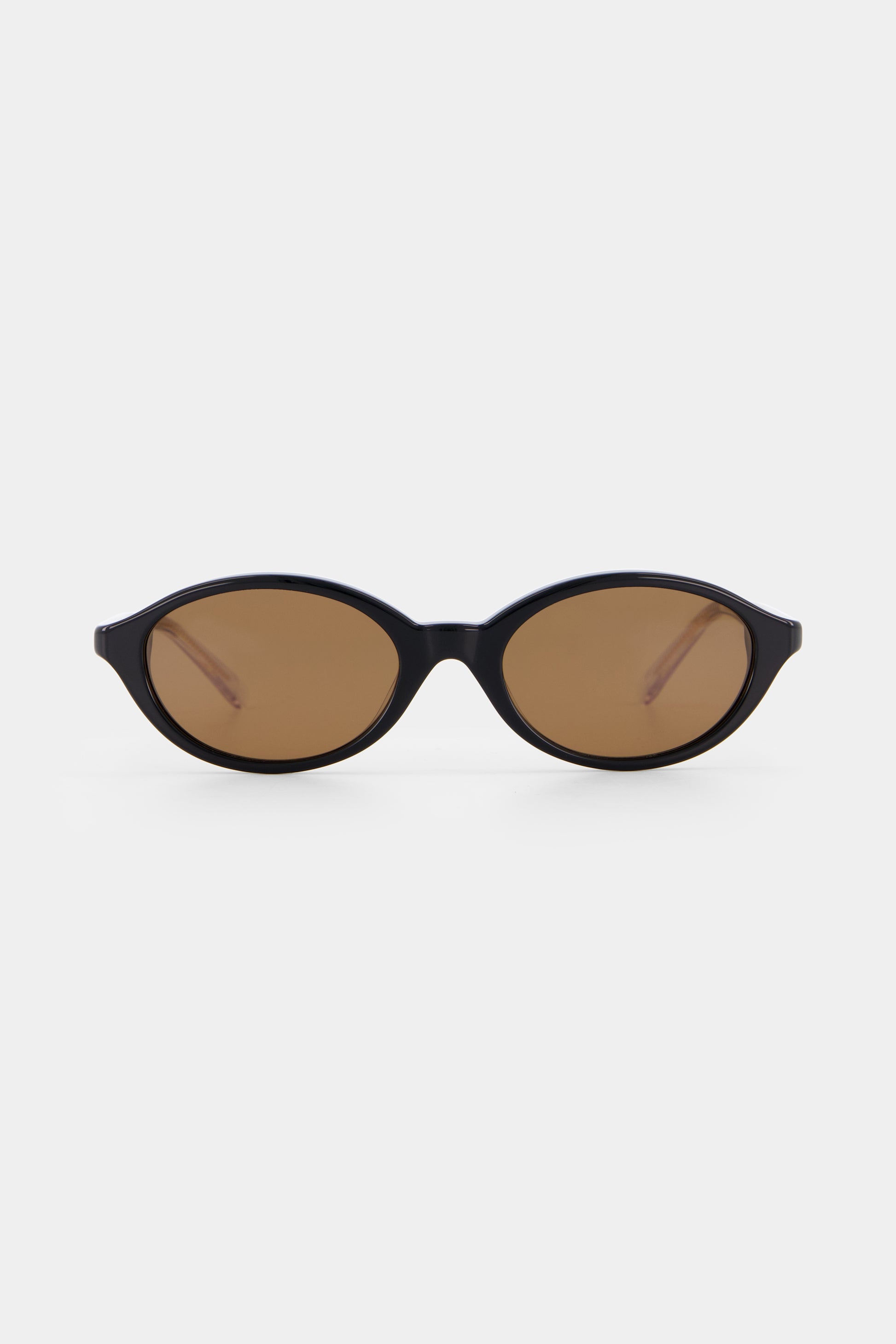 Isle of Eden Mirabel black sunglasses, front view showing sleek oval frame and brown lenses