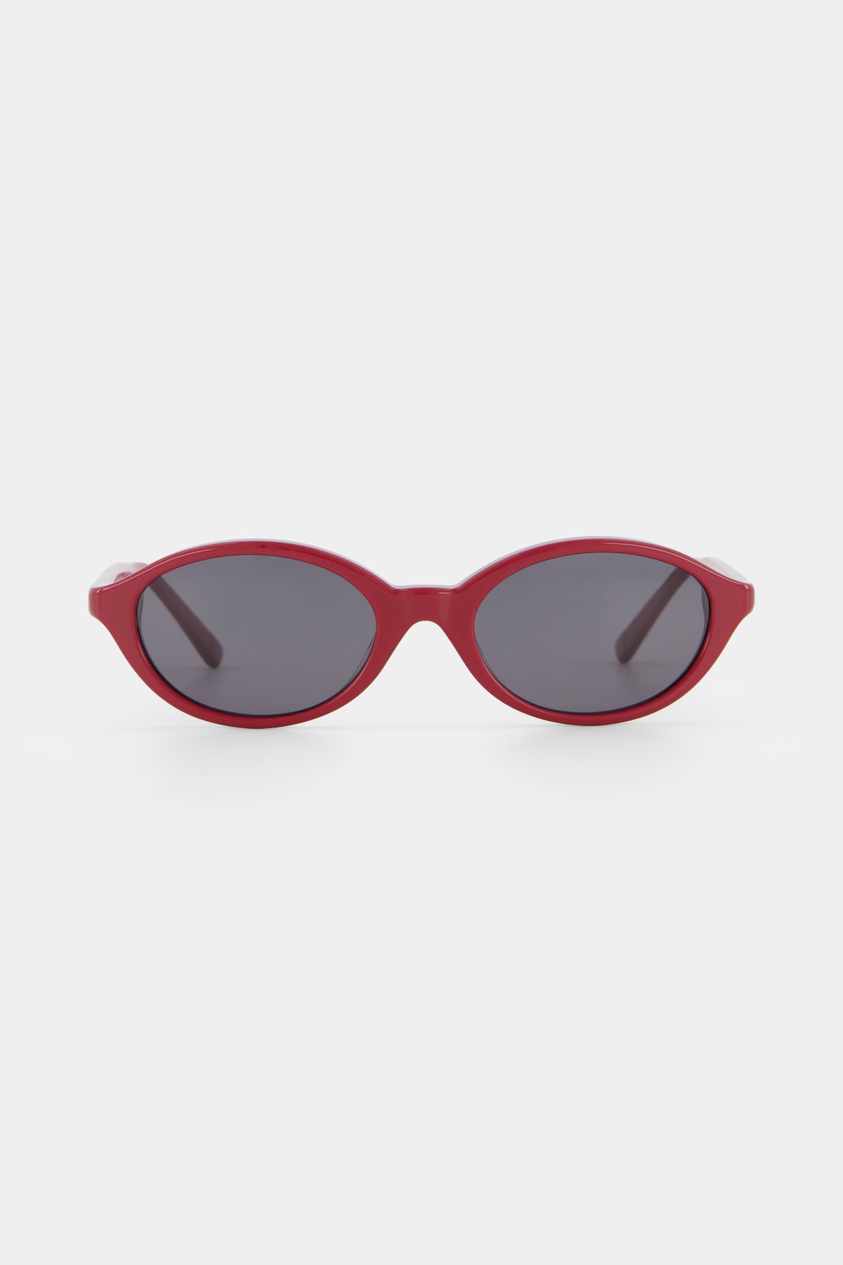 Isle of Eden Mirabel dark red sunglasses, front view showing sleek oval frame and dark lenses