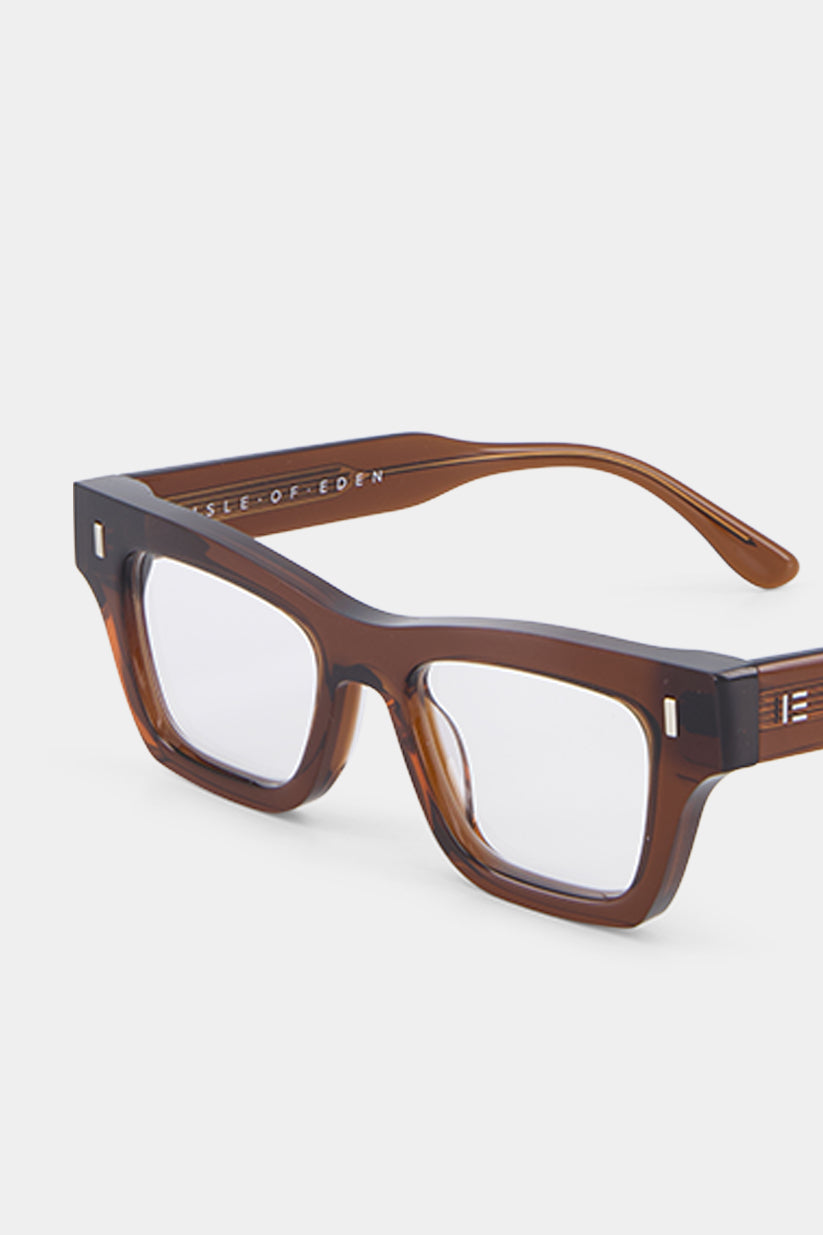 Isle of Eden Olli prescription glasses, angled side view showing the eco-conscious brown bio-acetate frame with brand lettering detail