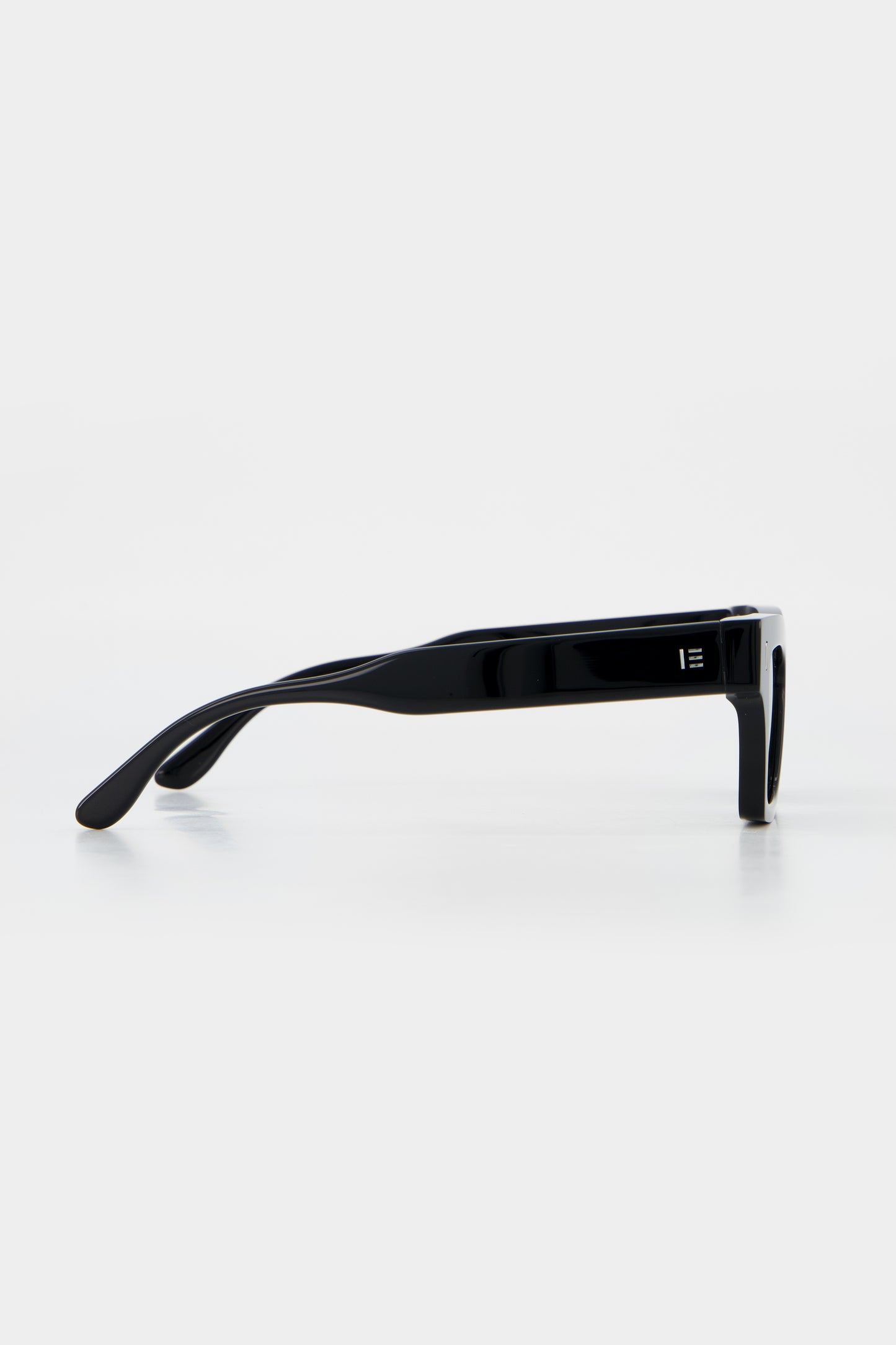 Isle of Eden Olli black sunglasses, side profile view showing temple length and hinge detail