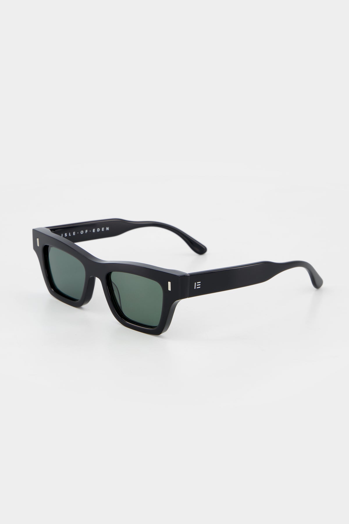 Isle of Eden Olli black sunglasses, three-quarter angle showing low-profile art-deco frame