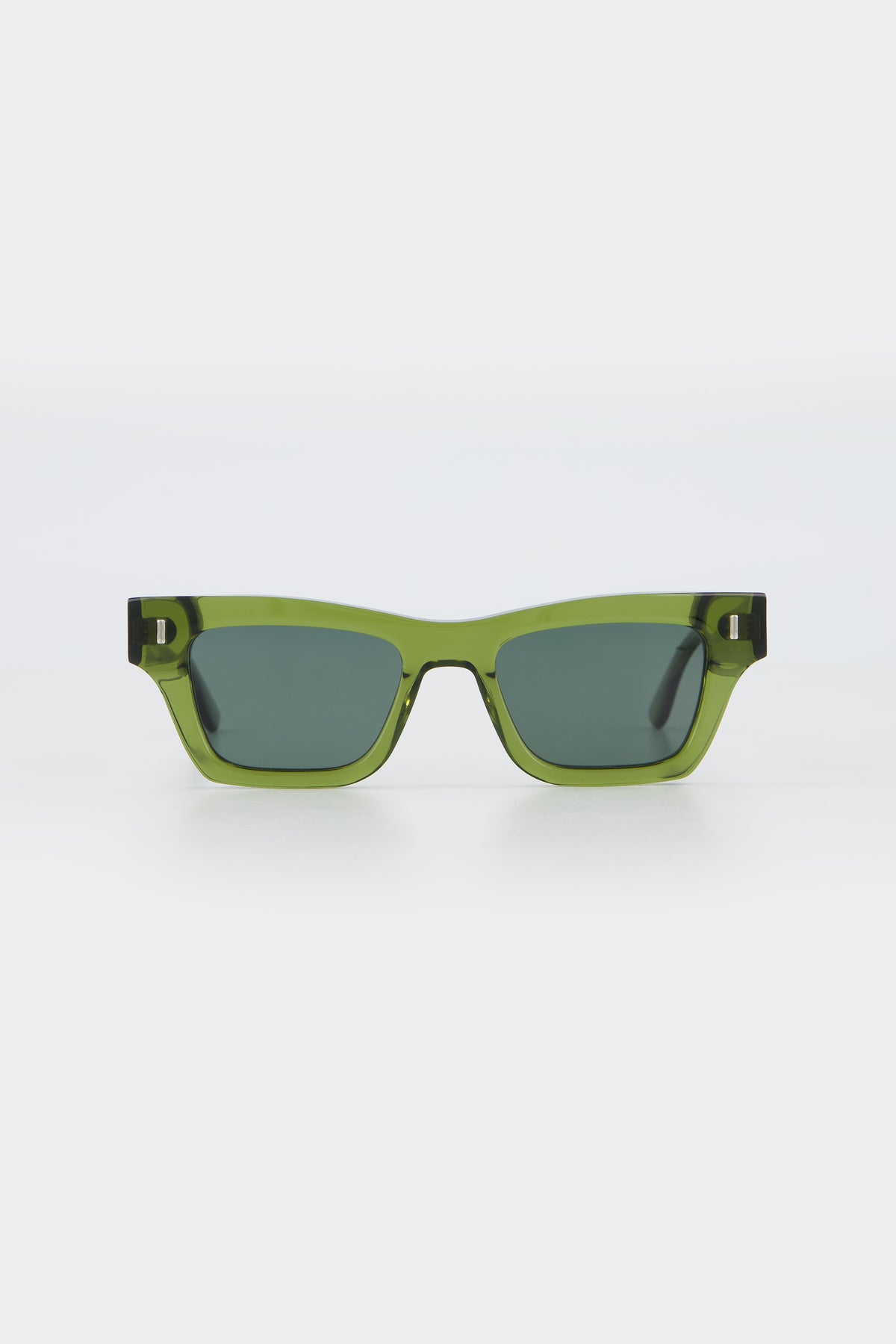 Isle of Eden Olli bottle green sunglasses, front view showing low-profile art-deco frame and dark green lenses