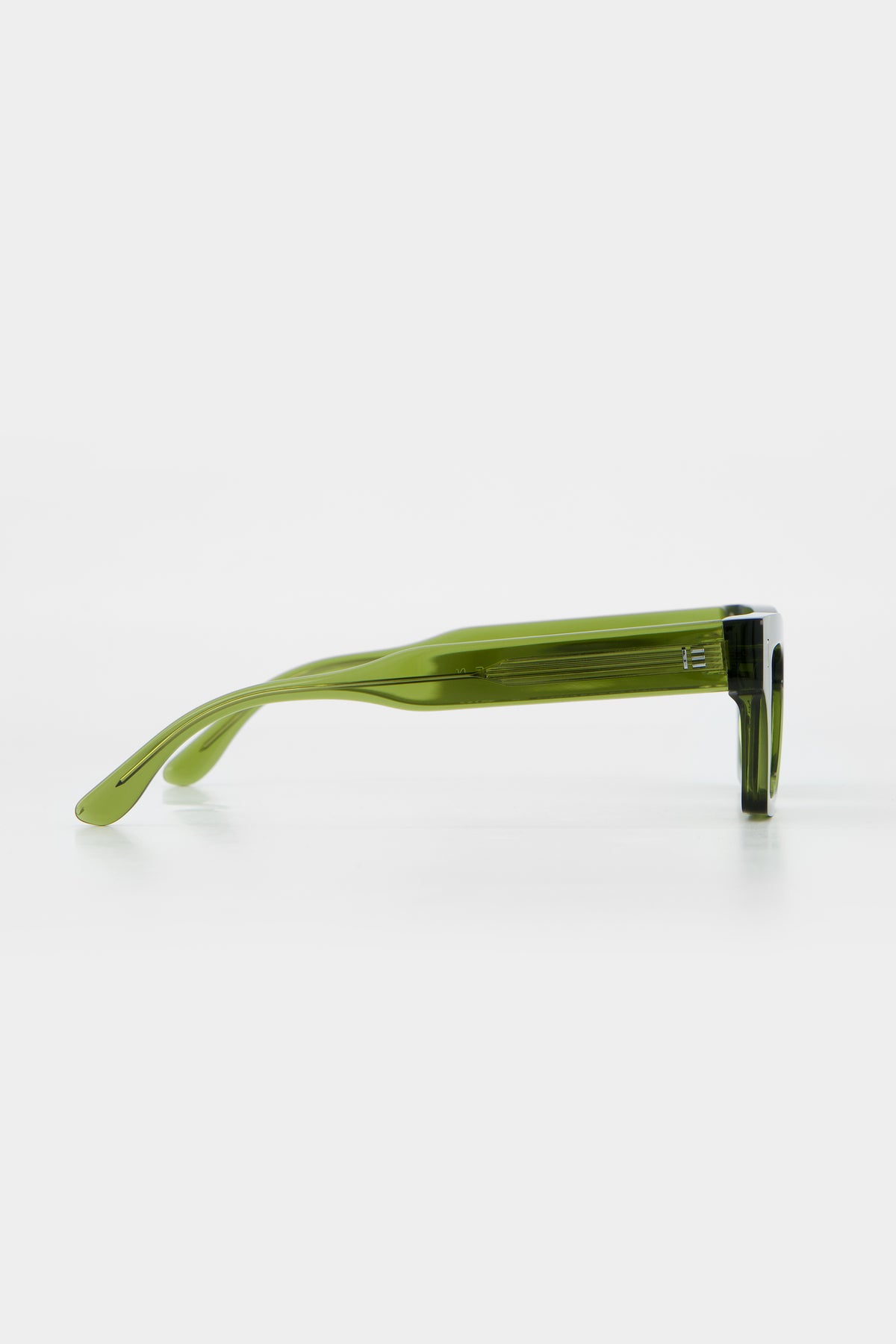Isle of Eden Olli bottle green sunglasses, side profile view showing temple length and hinge detail