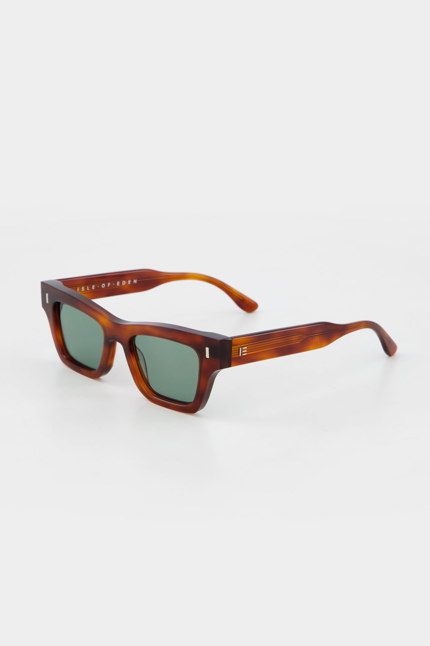 Isle of Eden Olli honey tortoise sunglasses, three-quarter angle showing low-profile art-deco frame