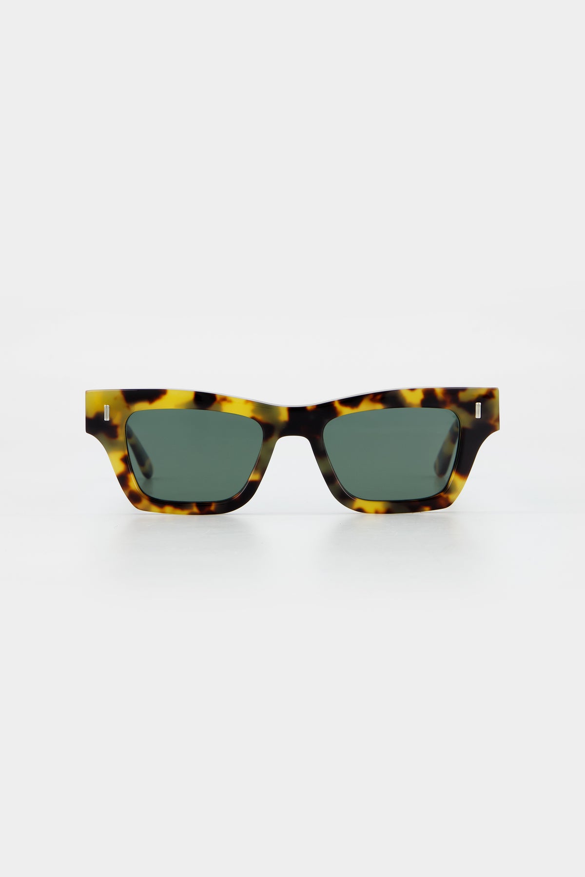 Isle of Eden Olli tortoise sunglasses, front view showing low-profile art-deco frame and green lenses