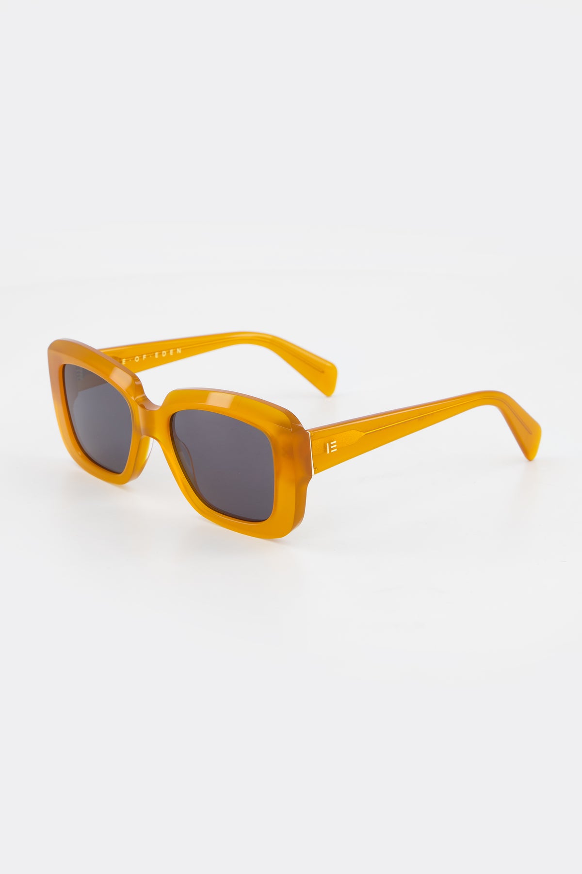 Isle of Eden Pia peach sunglasses, three-quarter angle showing bold rectangular frame