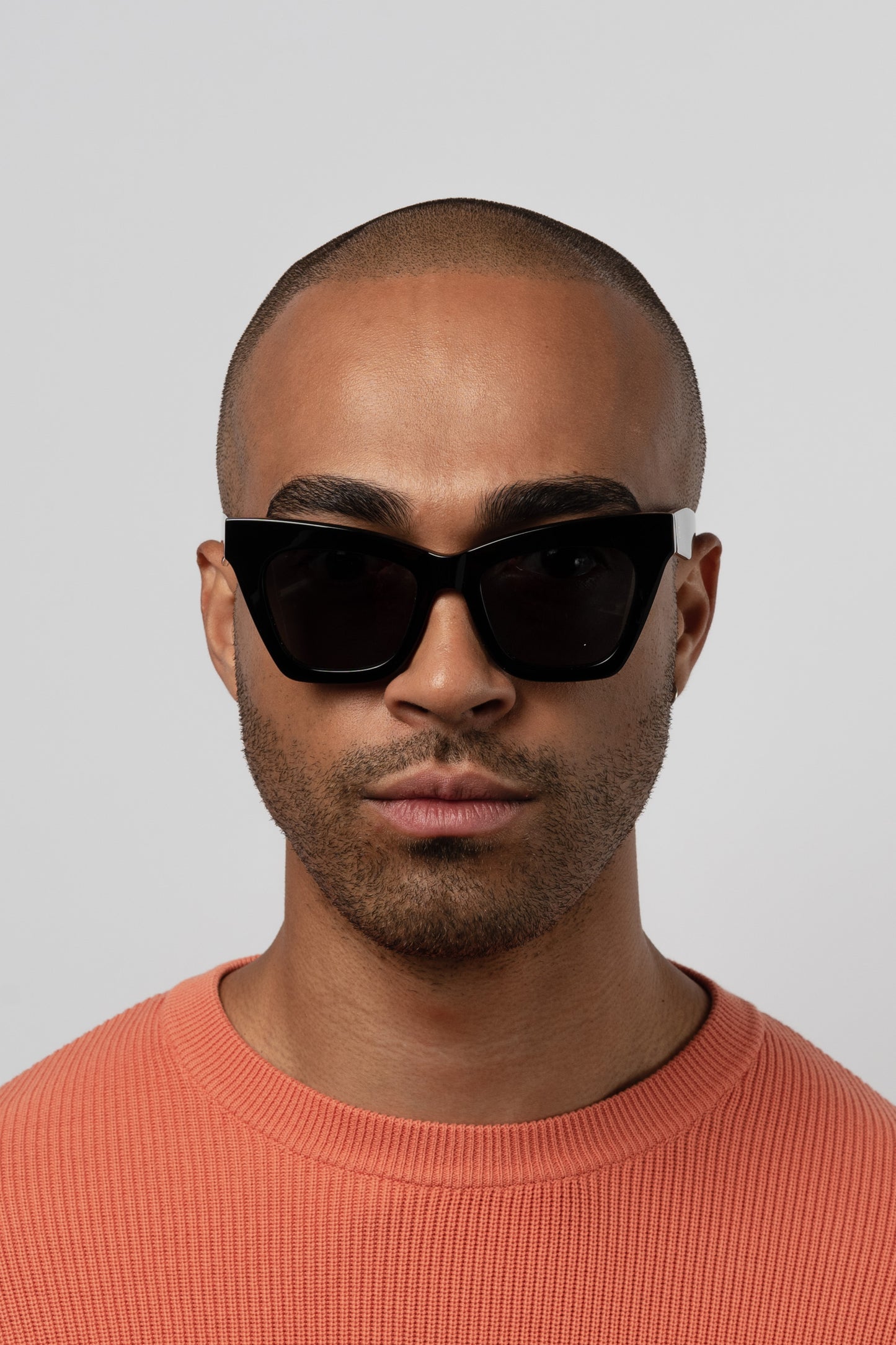 Man wearing Isle of Eden Sienna black sunglasses, close front-facing portrait