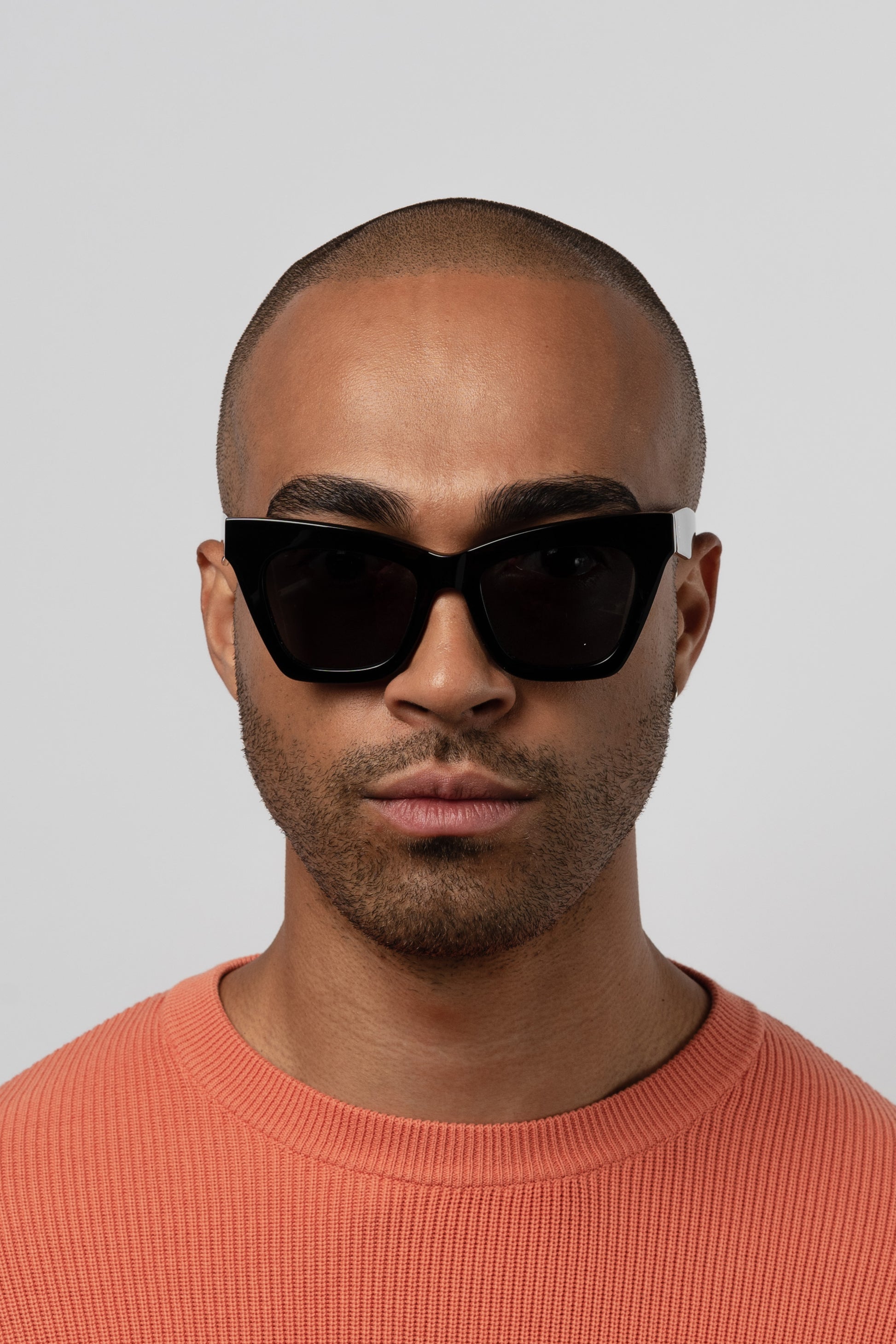 Man wearing Isle of Eden Sienna black sunglasses, close front-facing portrait